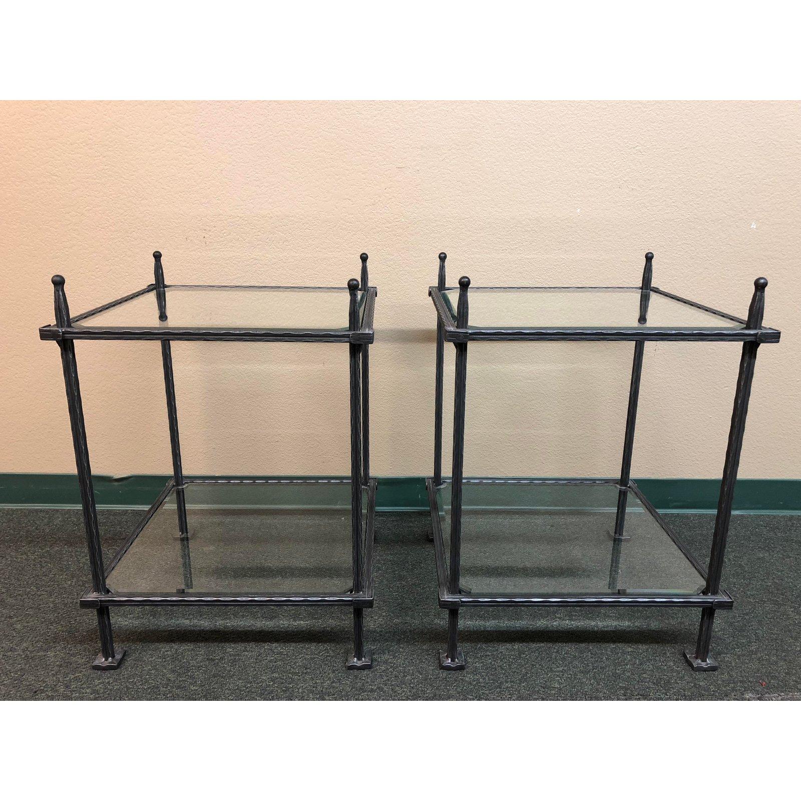 A pair of wrought iron and beveled glass tables by Claudio Rayes. Designed in Italy and crafted in Buenos Aires. The strong buy delicate pair have been created in a romantic rustic style, by heating and hammering the iron into an original design by
