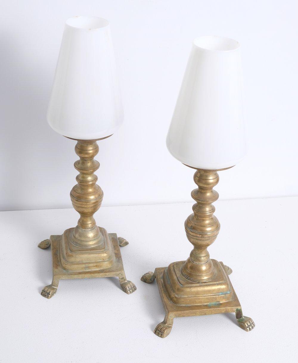 Pair of Claw Footed Antique Brass Storm Lamps. Nicely patinated. Includes glass shades.

