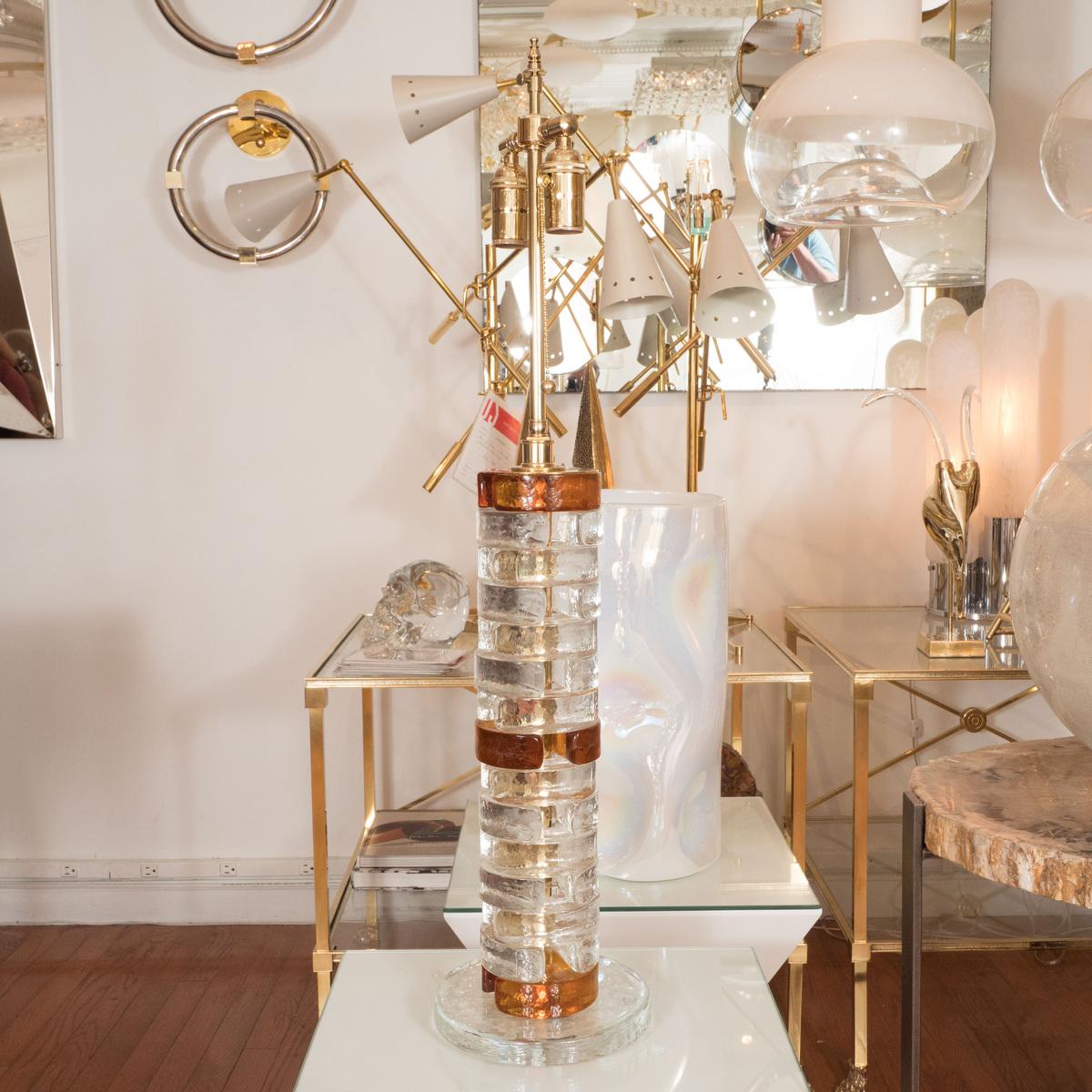 Pair of clear and amber glass table lamps composed of stacked elements.