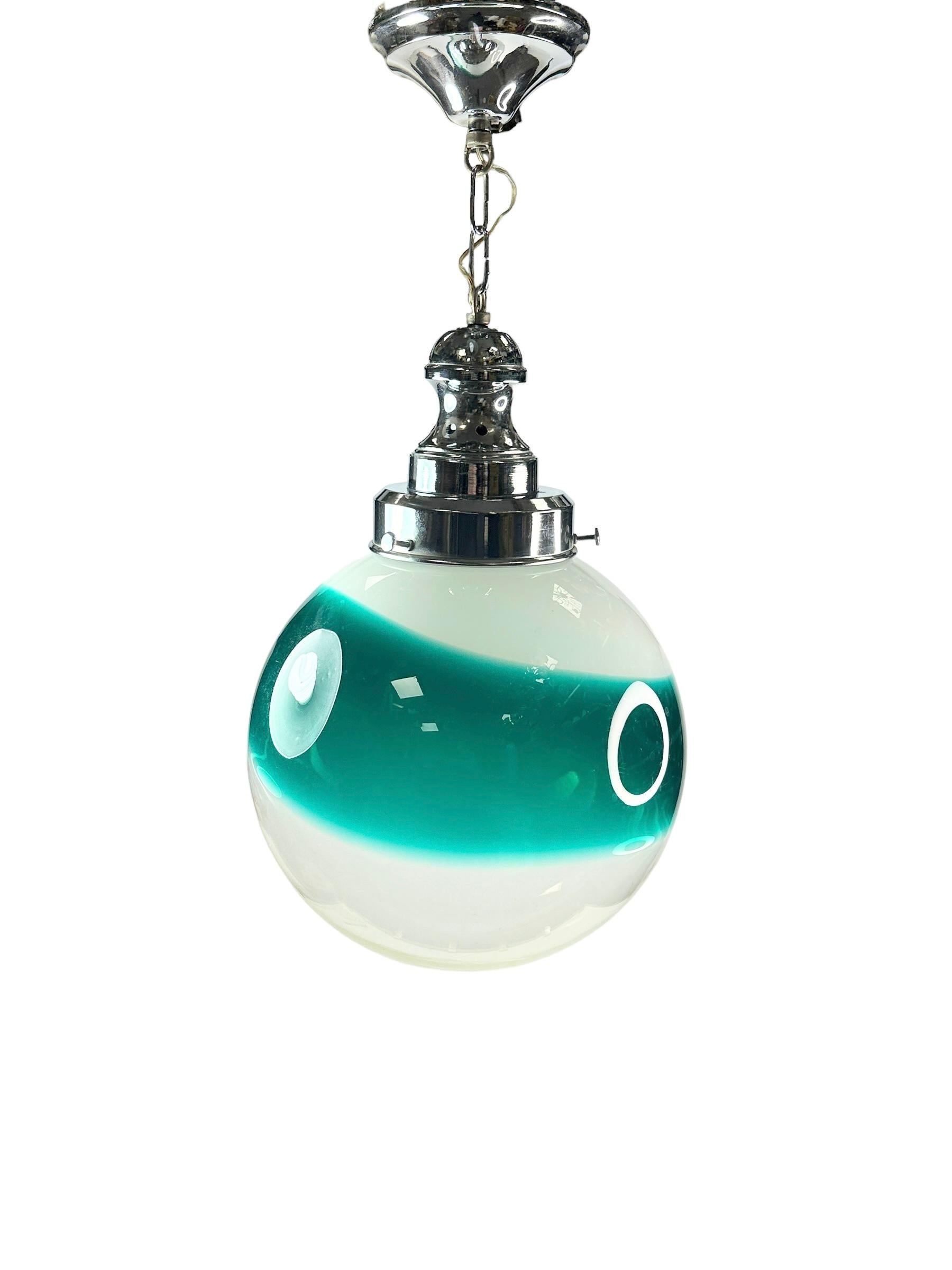 A pair of large mid-century swirl pattern glass ball fixture by a Murano Glass manufactory from Italy. Each Fixture requires one European E27 Edison bulb, up to 100 watts. Glass ball only is approximate 12