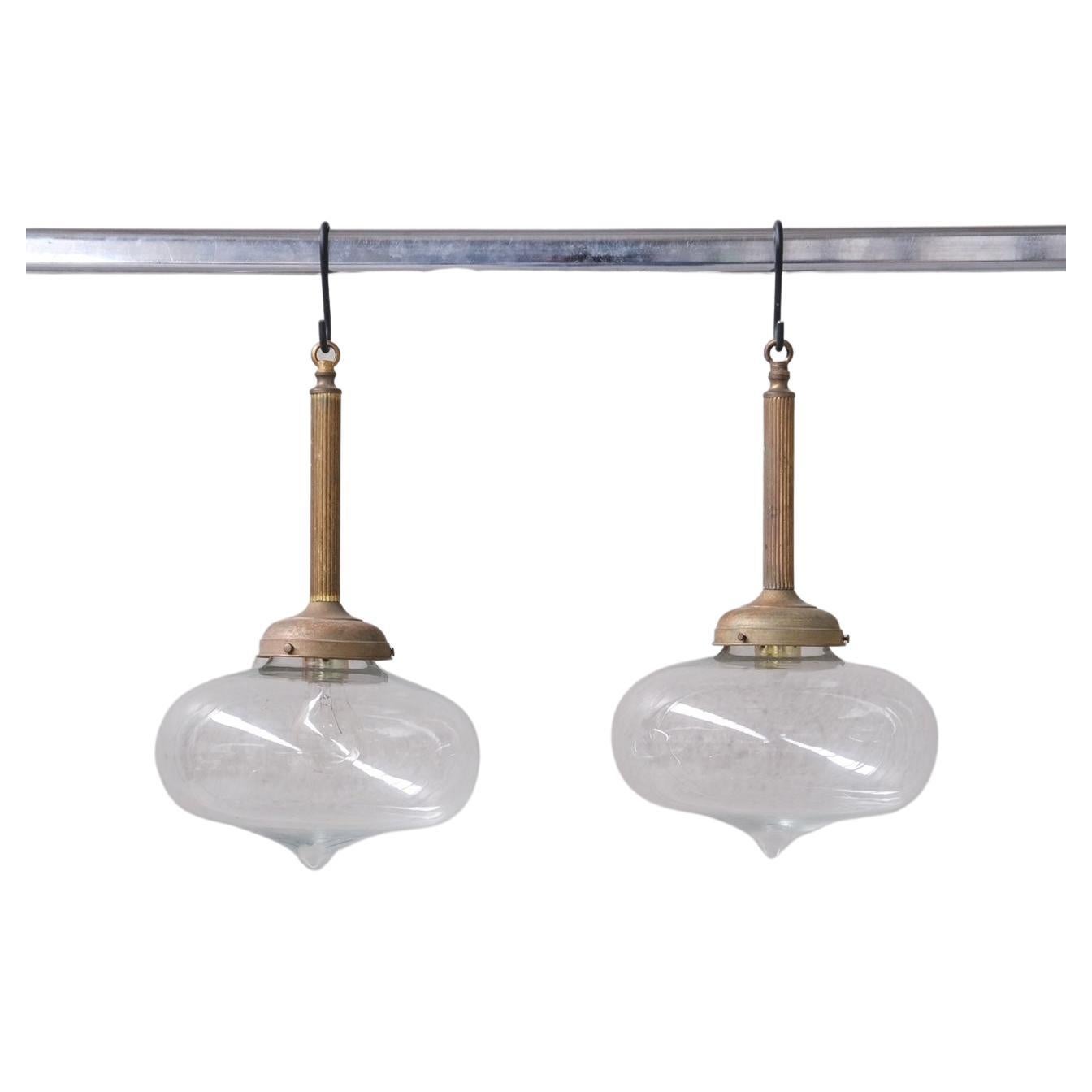Pair of Clear Glass and Brass Mid-Century Teardrop Pendant Lights