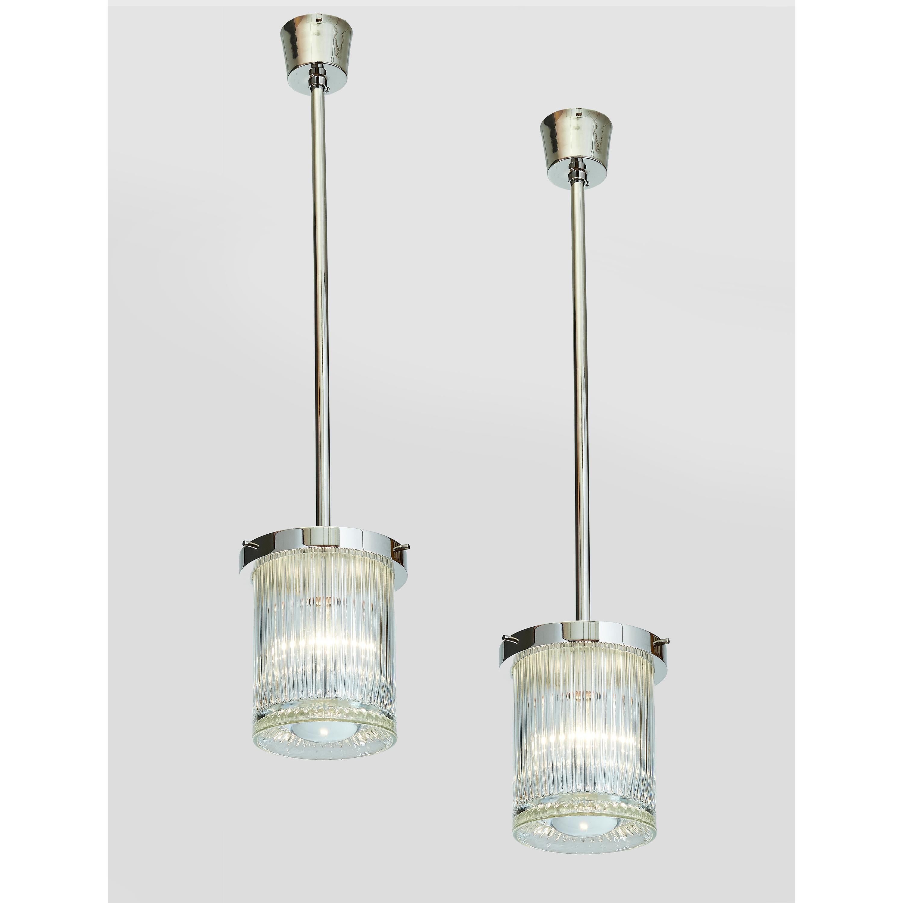 Contemporary Pair of Clear Ribbed Glass Lanterns with Central Oculus Lens For Sale