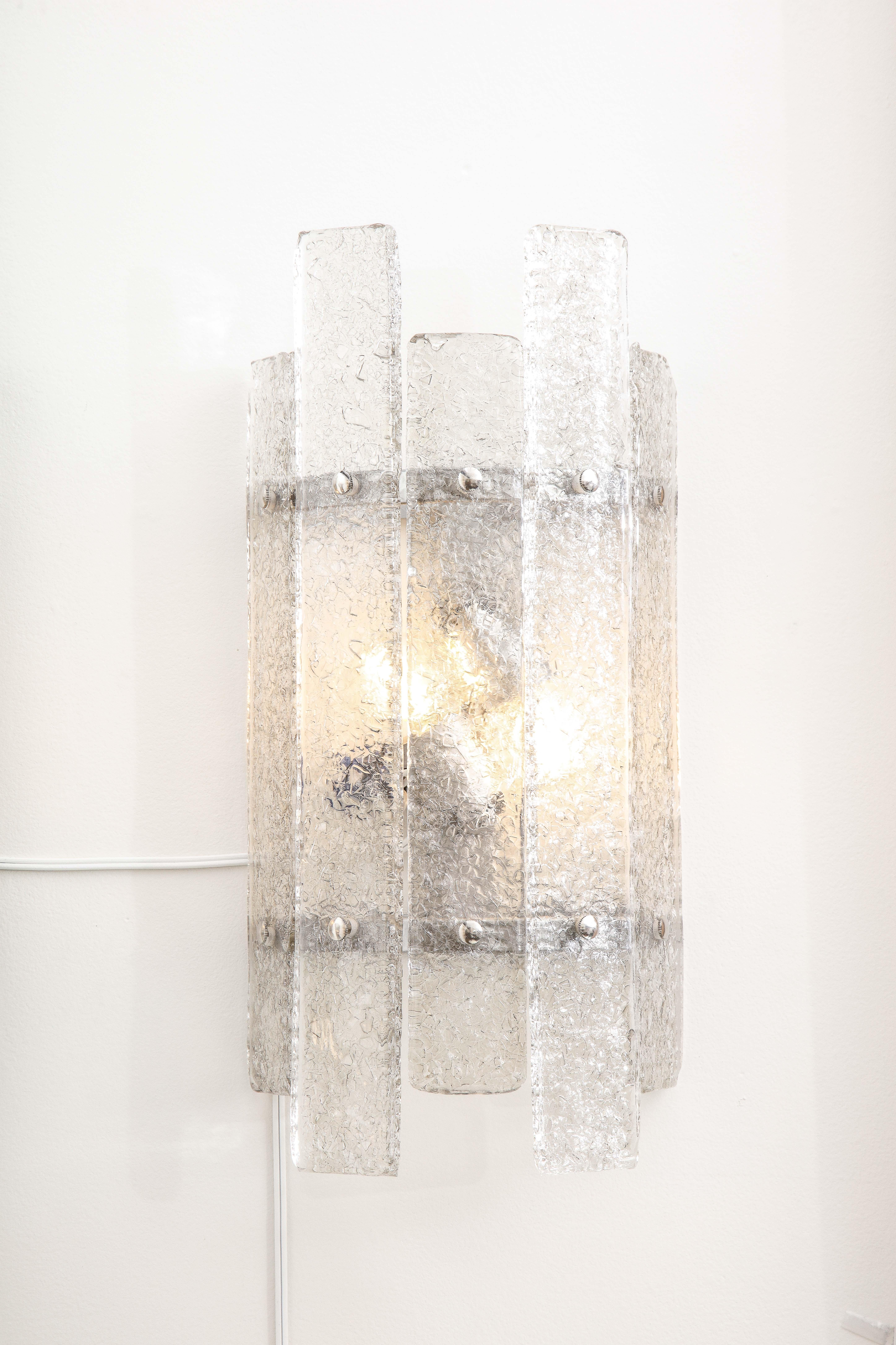 Pair of clear and textured Murano glass and Nickel sconces handcrafted in Italy. Each sconce consists of individually casted and textured clear Murano glass rectangular rods which are held in place with solid nickel capped screws onto a nickel
