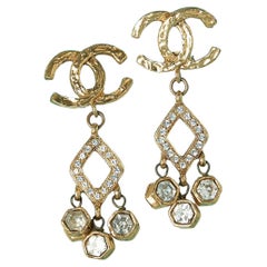 Pair of Clip-on earrings in gold metal and rhinestone Chanel 