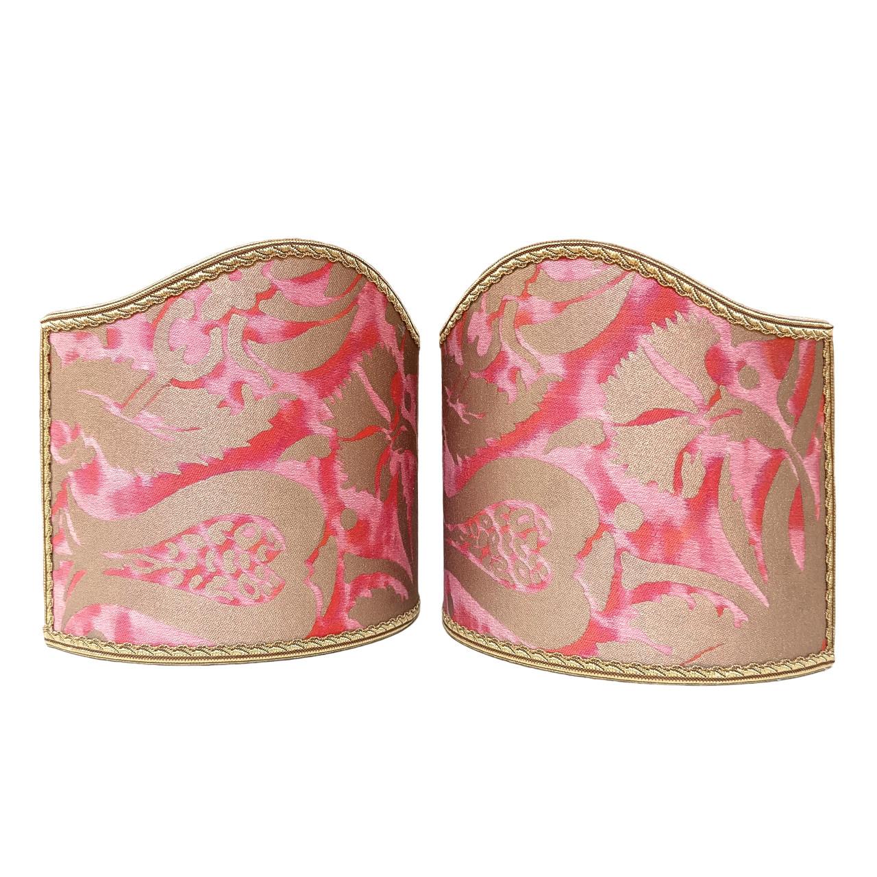This pretty set of 2 clip on wall sconce lampshades with a fitting that clips over the light bulb is handmade using Fortuny fabric - Pomegranate pattern - in coral haze & silvery gold color, finished with gold trim. Suitable for candelabra bulbs