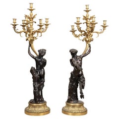 Pair of Clodion Figural Patinated Candelabra