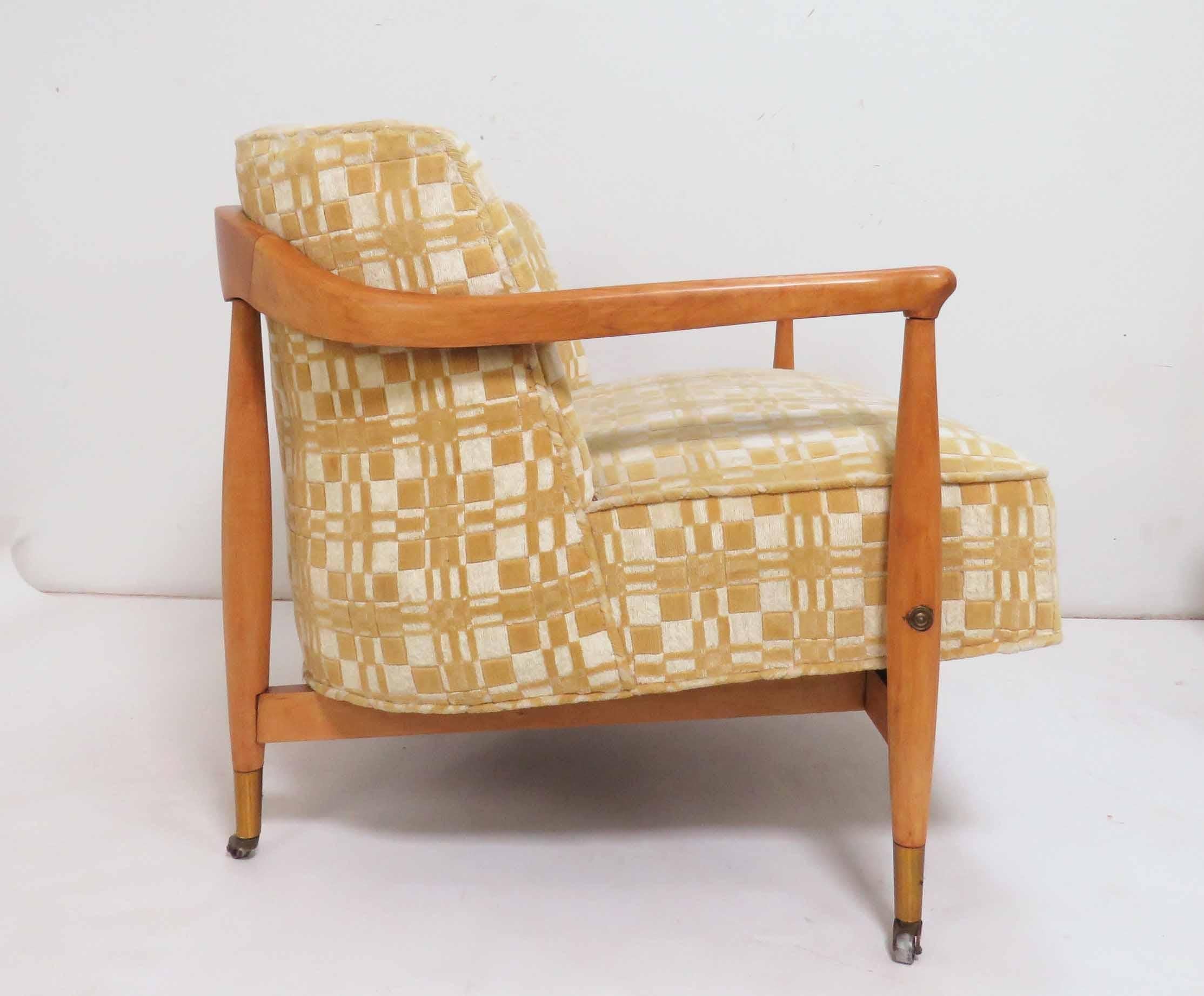 Pair of barrel back club chairs in the manner of Ib Kofod-Larsen for Selig, circa 1950s. Birch frames, original chenille upholstery.