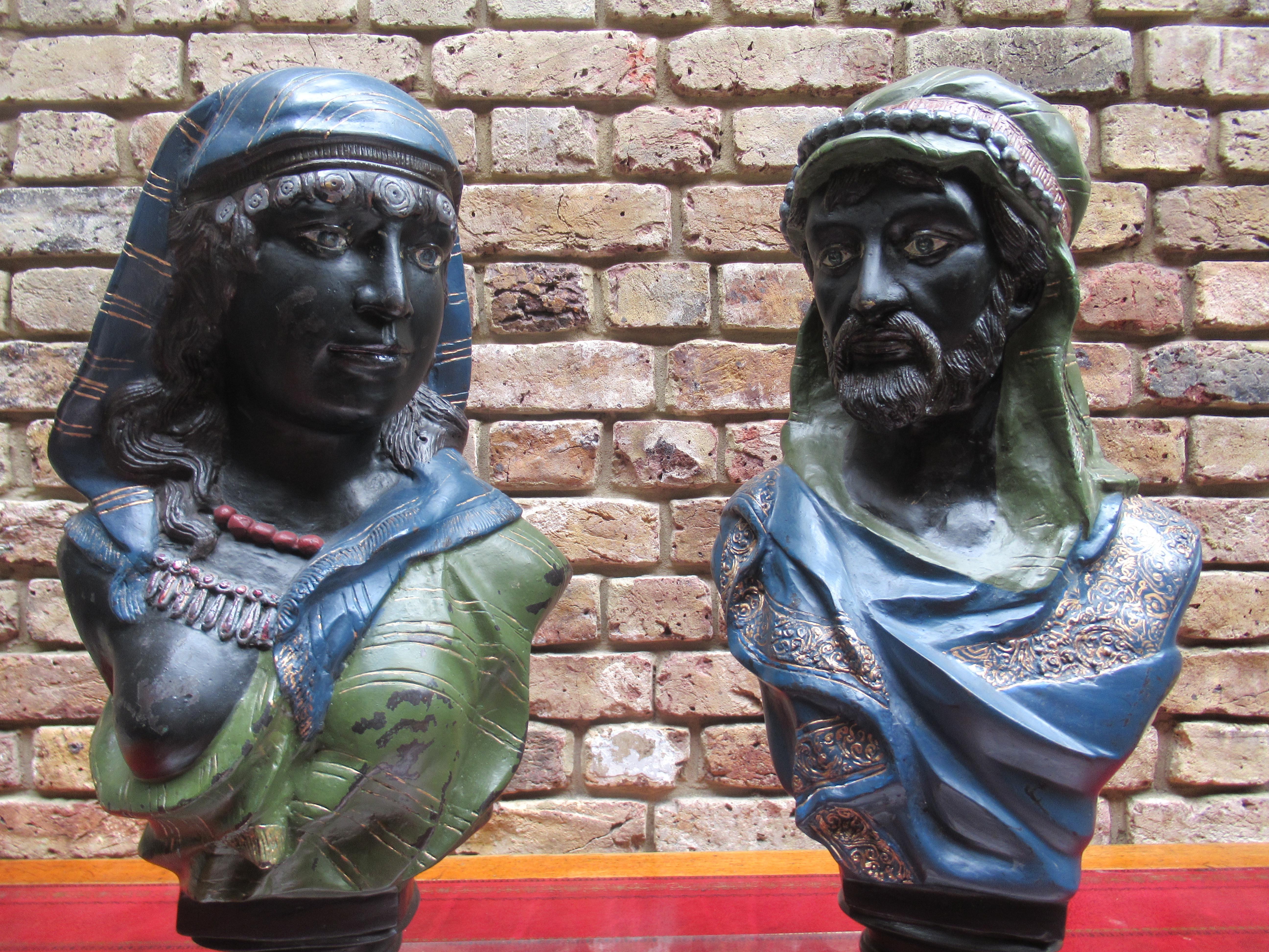 A pair of coal painted bronze busts of an Arab man and woman, early 20th century.