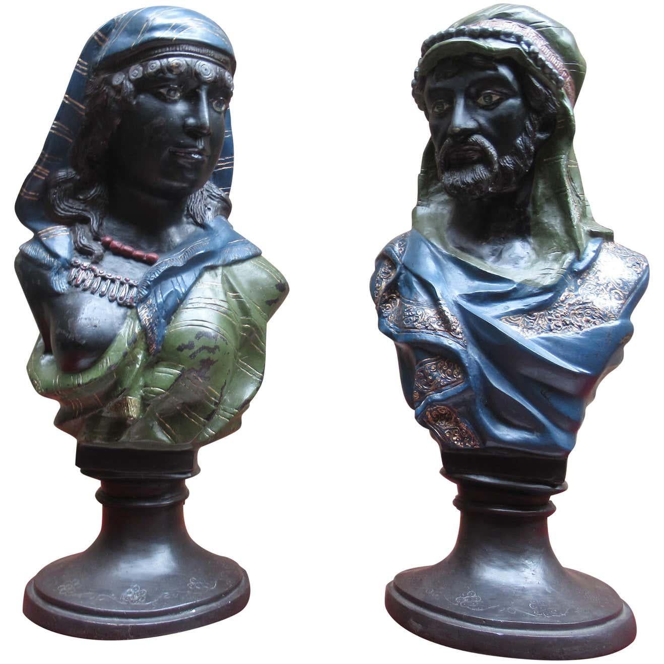 A pair of coal painted bronze busts of an Arab man and woman, early 20th century.