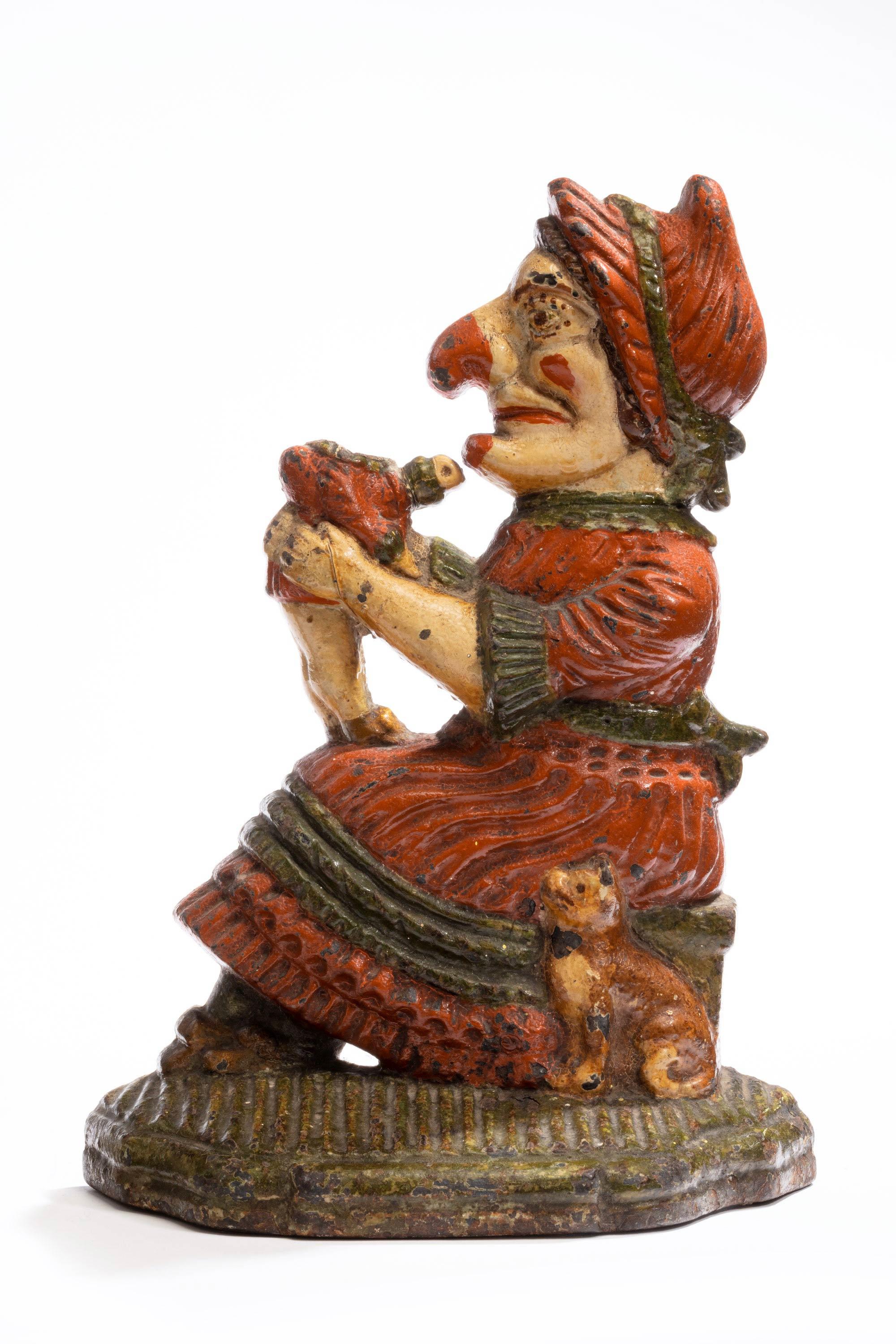 A pair of coalbrookdale punch and judy doorstops.