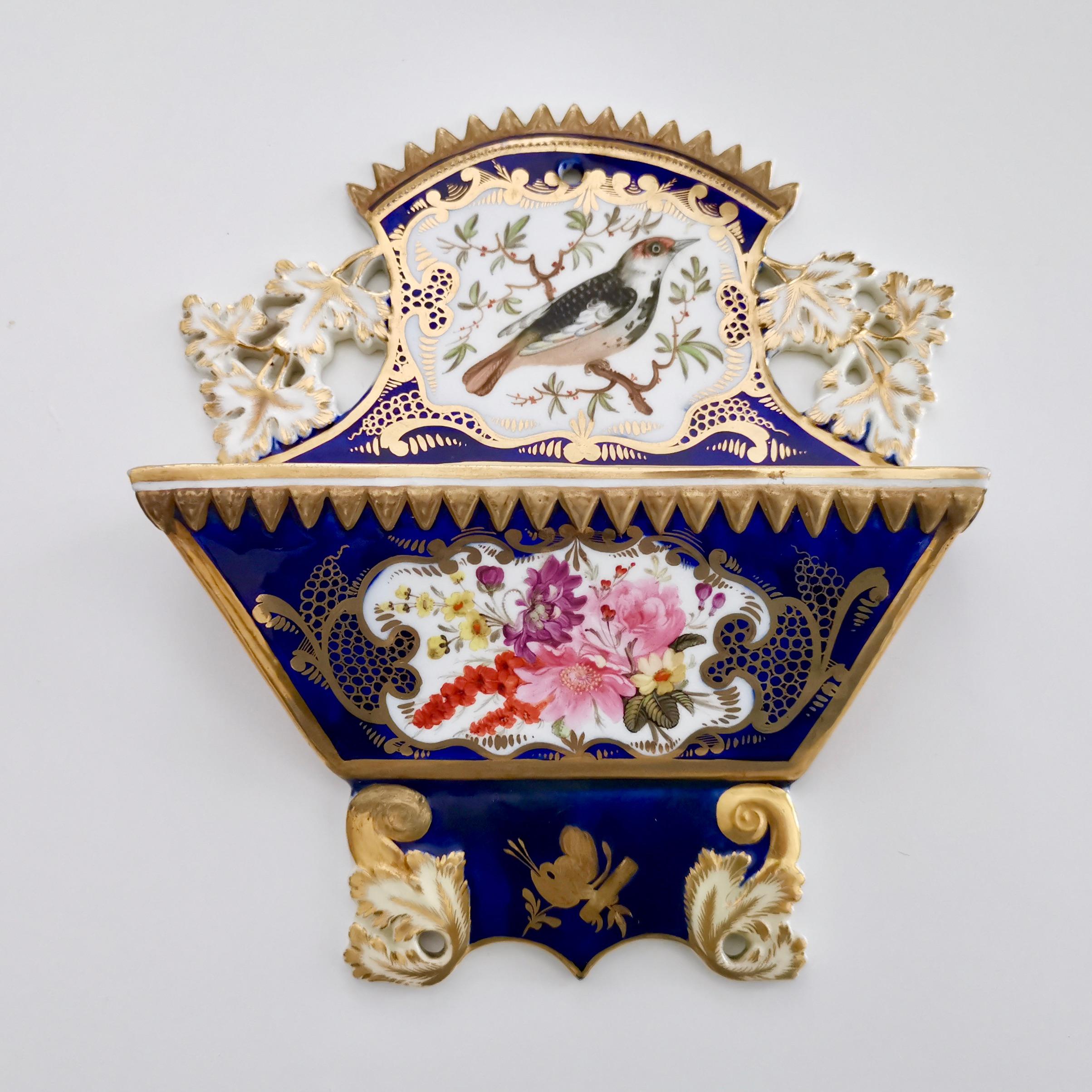 This is a stunning pair of porcelain letter racks made by Coalport between about 1815 and 1820. The racks bear the famous and very wonderful bird pattern with the number 759. These racks were used in the entrance hall of the houses of the well to