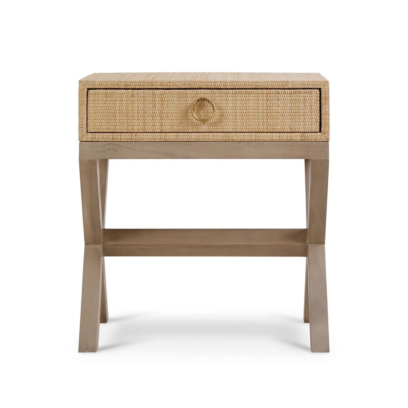 Crafted from high-quality wood and wrapped in beautifully woven natural finish rattan, this nightstand brings a touch of coastal charm to any bedroom. The natural finish of the rattan is perfectly complemented by the elegant wooden X-frame base in