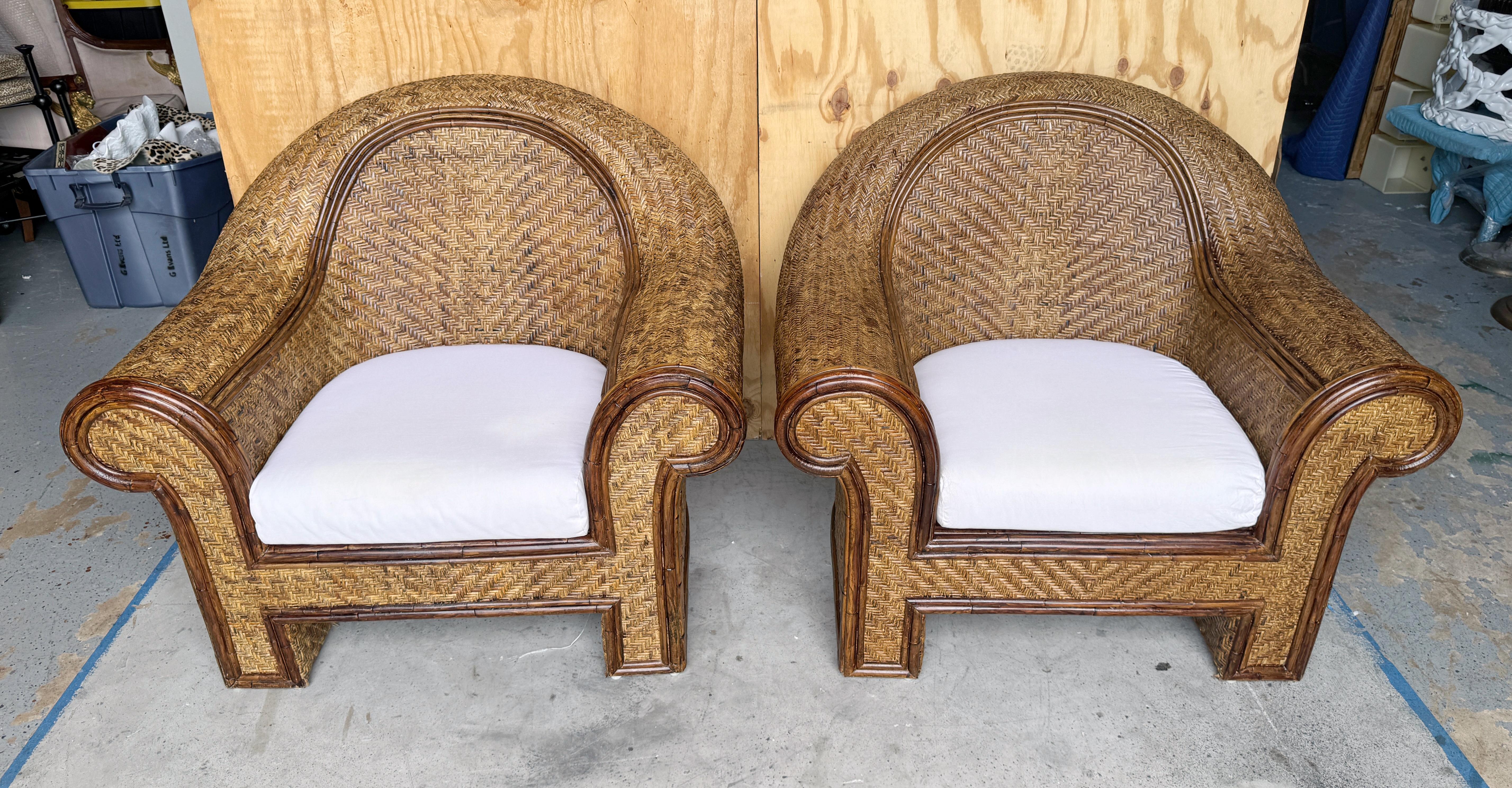 Pair of Coastal Rattan & Reed Woven Club Chairs, attributed to Ralph Lauren 

We are pleased to offer this pair of  Coastal Rattan & Reed Woven Club Chairs, attributed to the renowned designer Ralph Lauren. These  beautiful chairs boast generous