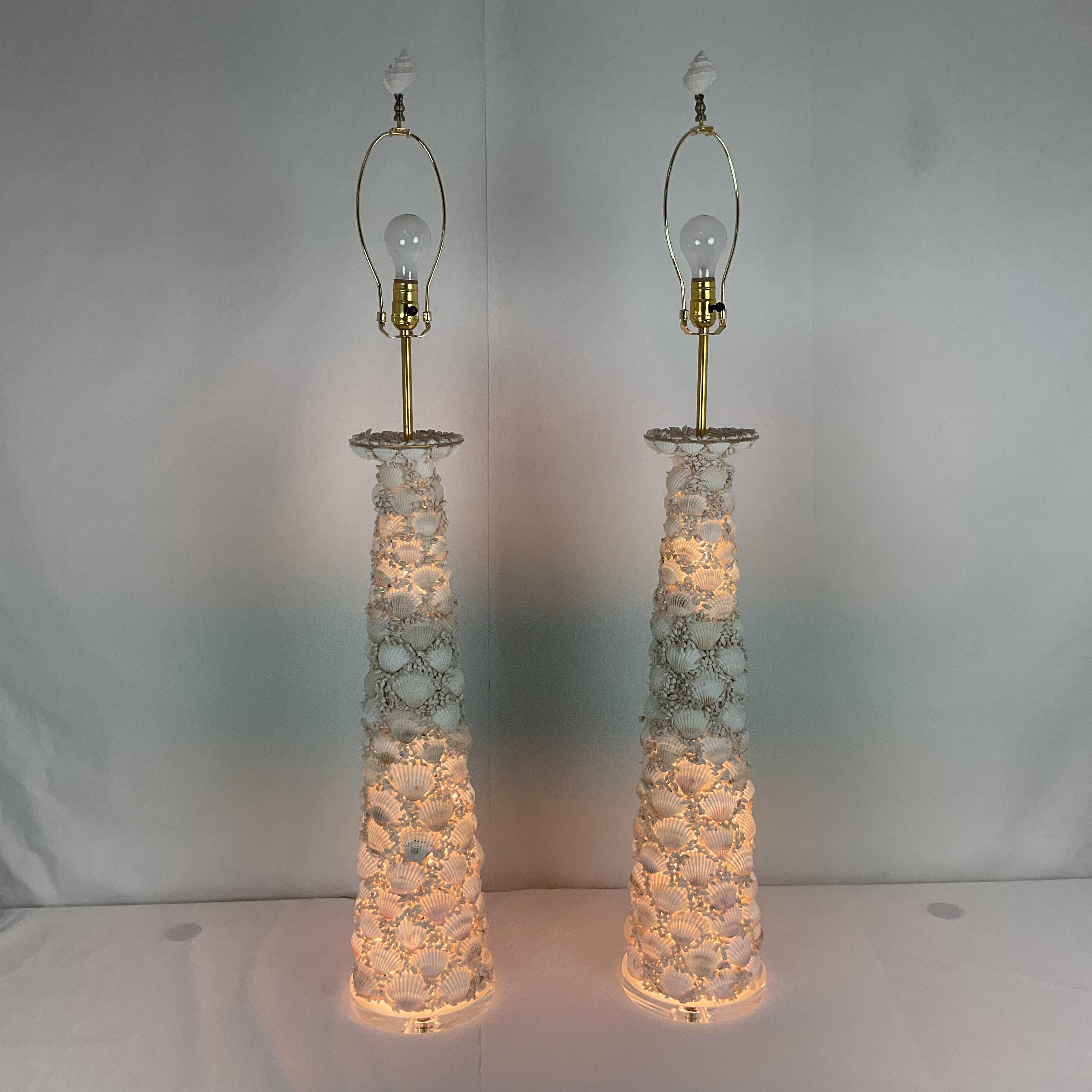 Enhance your space with this beautiful pair of tall table lamps, each uniquely handcrafted with natural seashells. These striking lamps bring a touch of coastal elegance and organic texture, making them the perfect accent for beach houses, coastal
