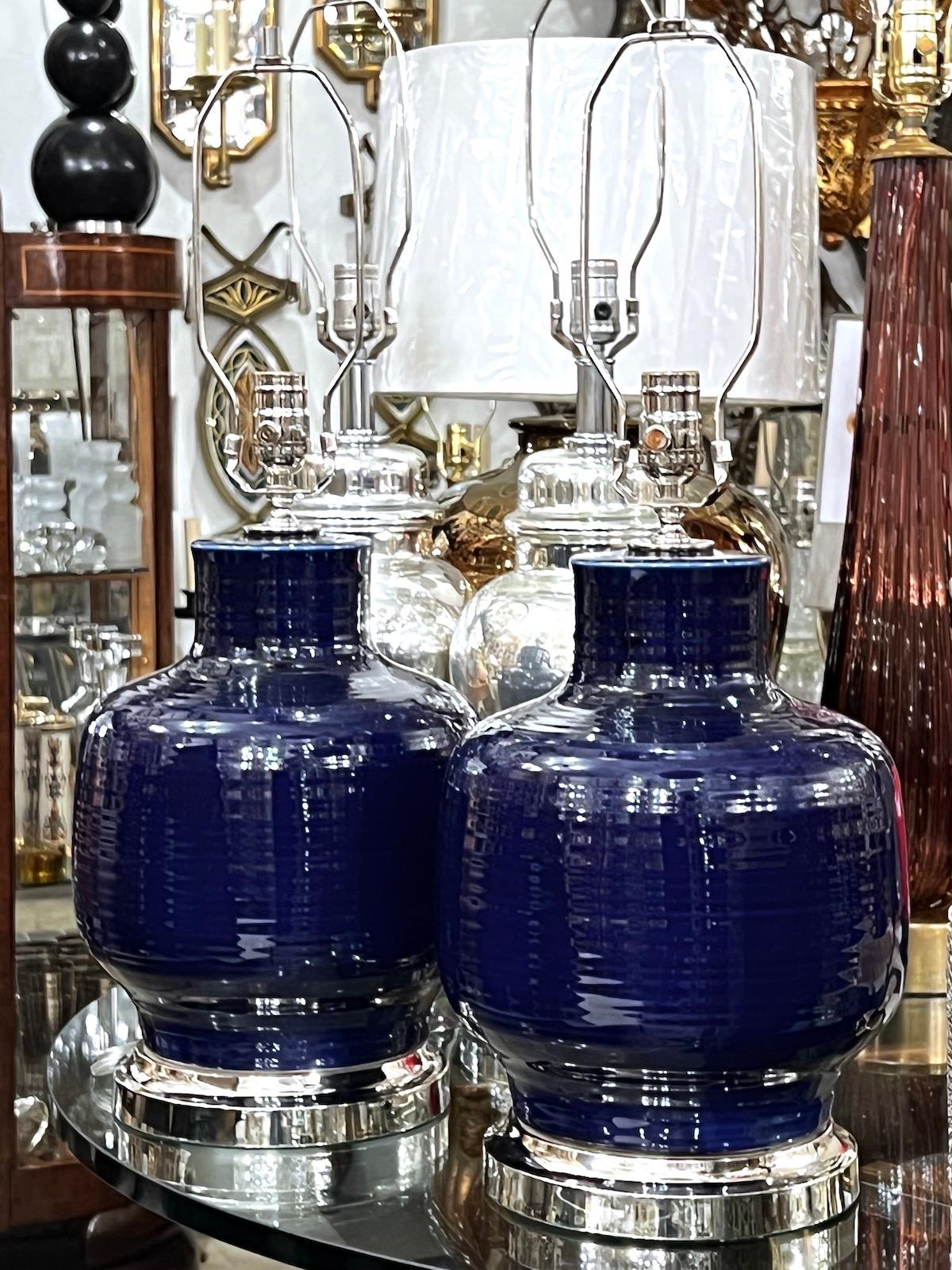 Pair of circa 1960's Italian cobalt blue ceramic table lamps with silver bases.

Measurements:
Height of body: 15
