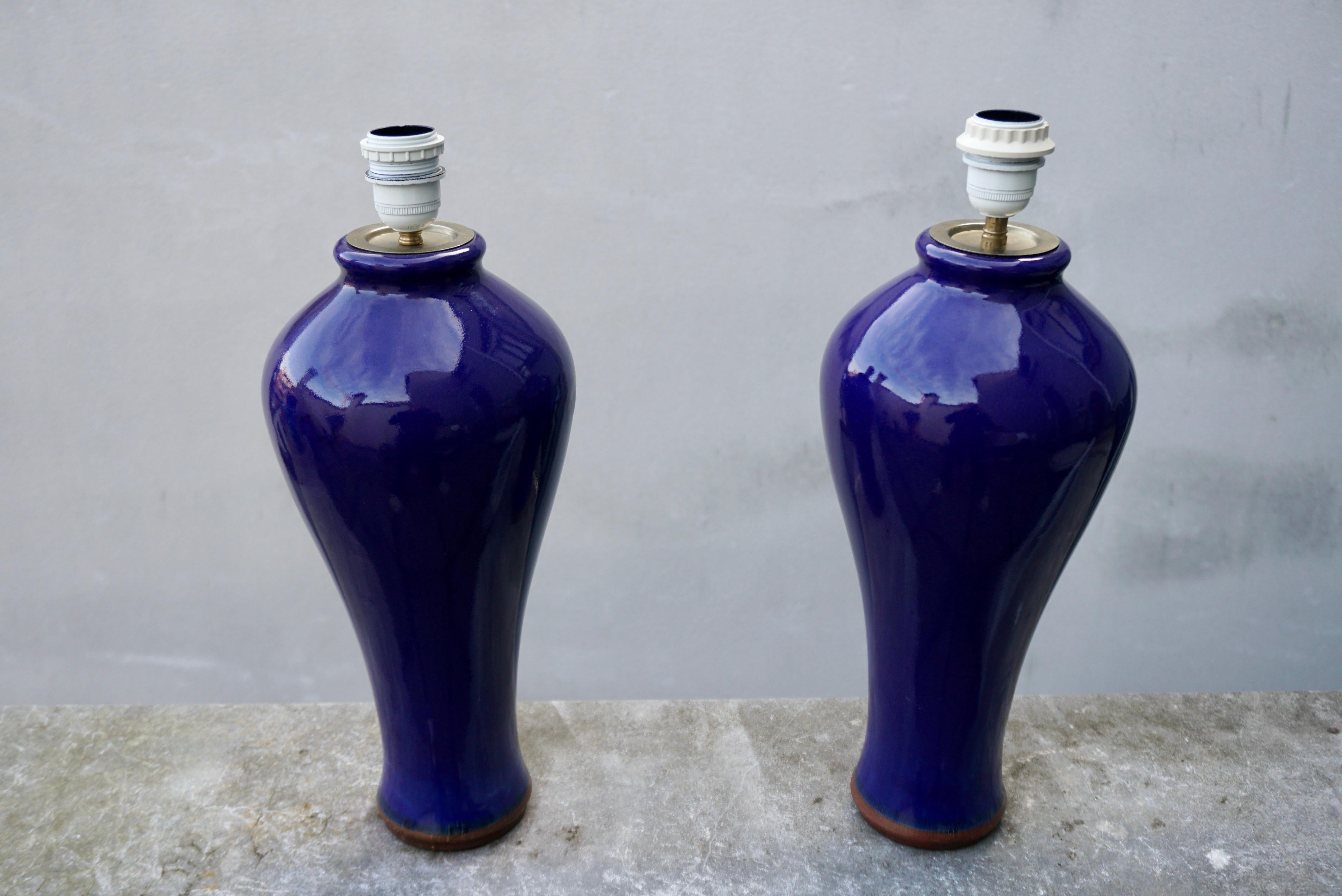 Pair of elegant ceramic glazed cobalt Blue Vases, Wired into Lamps.

The height of the lamp including the socket is: 18.8