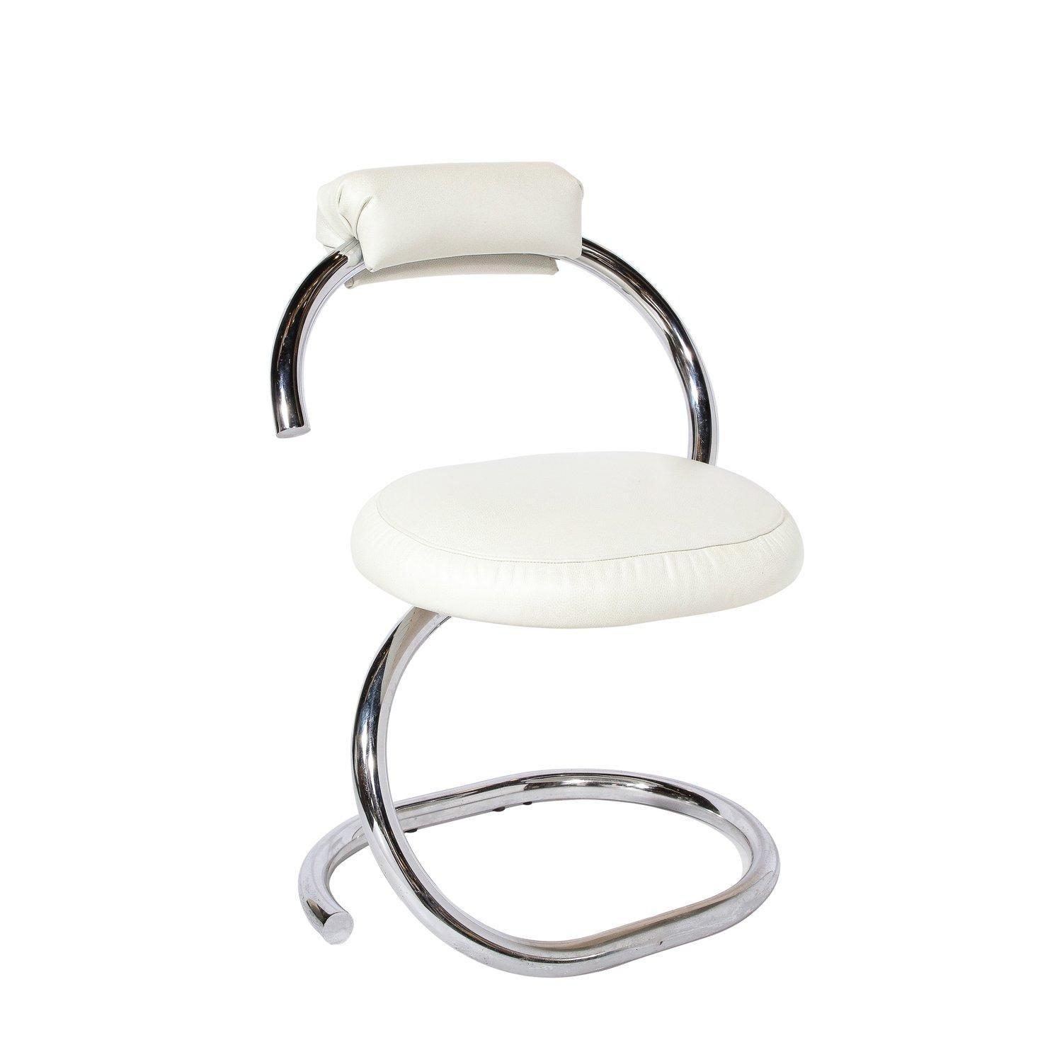 This Pair of Cobra chairs designed by Giotto Stoppino originates from Italy, circa 1970. A standout example of mid-century modernist design, these chairs are constructed of a single piece of aluminum that forms the base, seat and back. The amazing