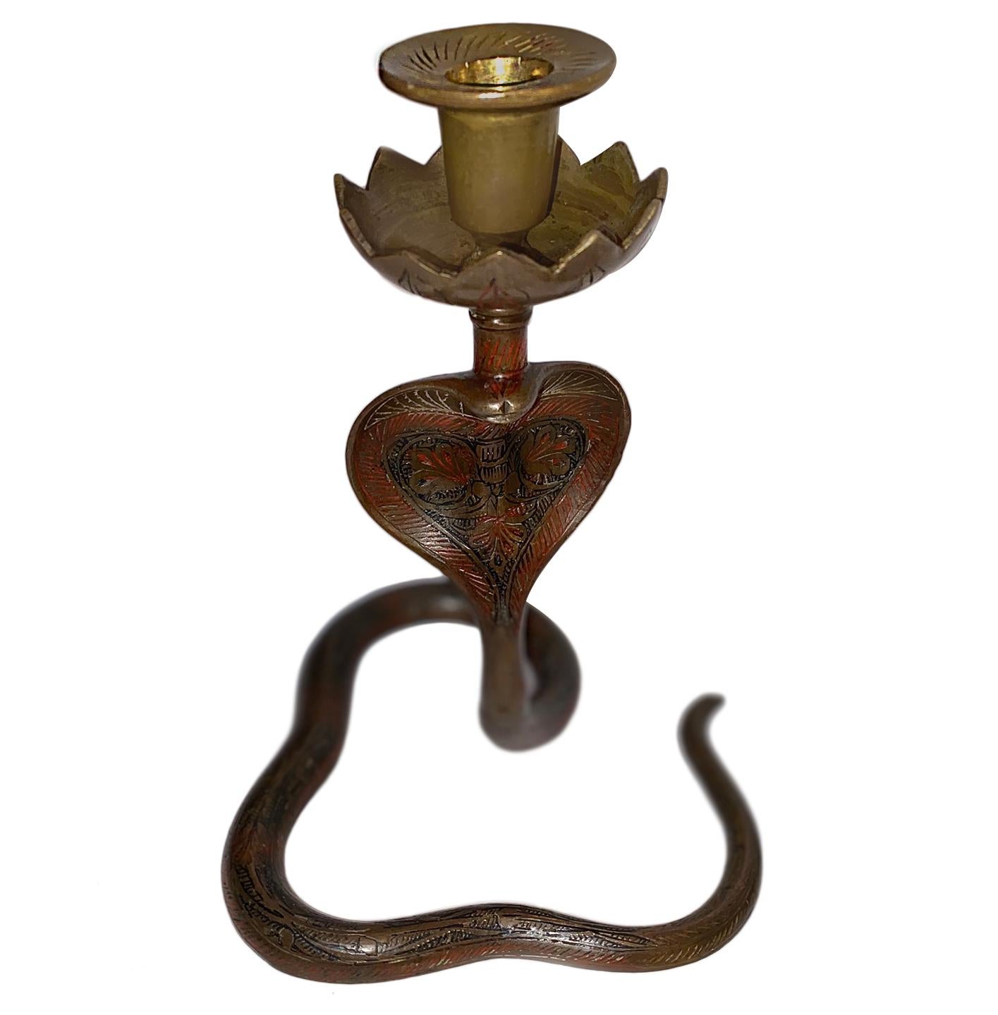 Pair of circa 1940's Moroccan brass cobra shaped candlesticks.

Measurements:
Height of body: 8