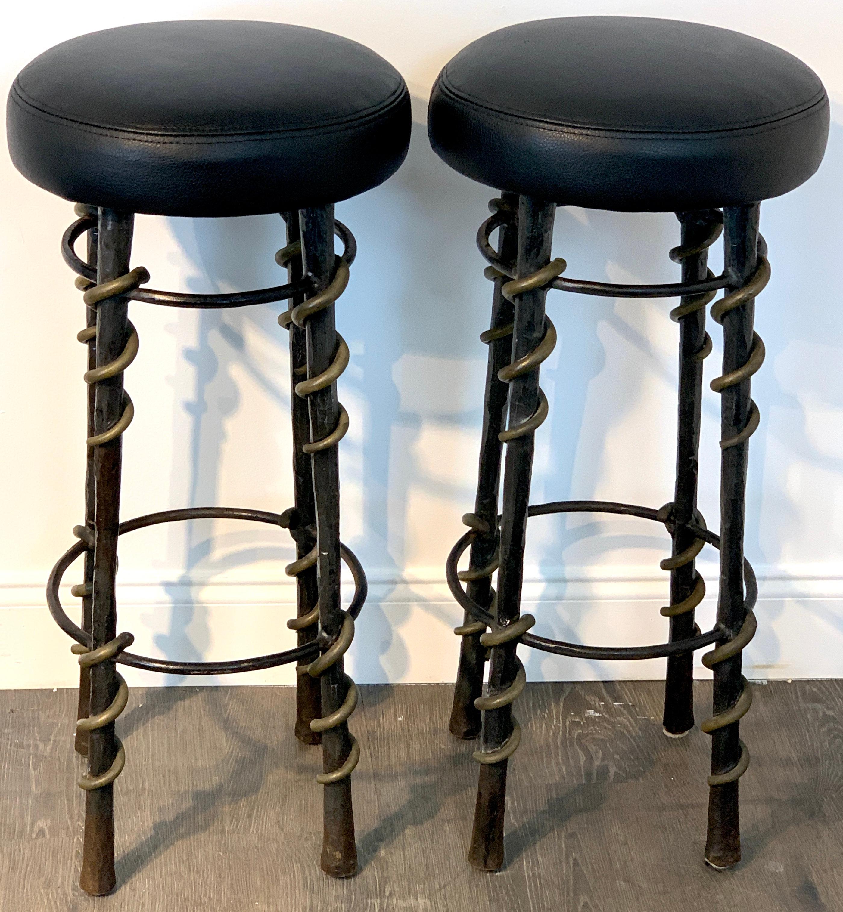 Pair of 'Cobra' stools by Karl Springer, A rare form, each one upholstered in calfskin black leather, handmade of wrought iron and bronze. 

Provenance: Acquired directly from Karl Springer Personally. Original tear sheet included. 
 