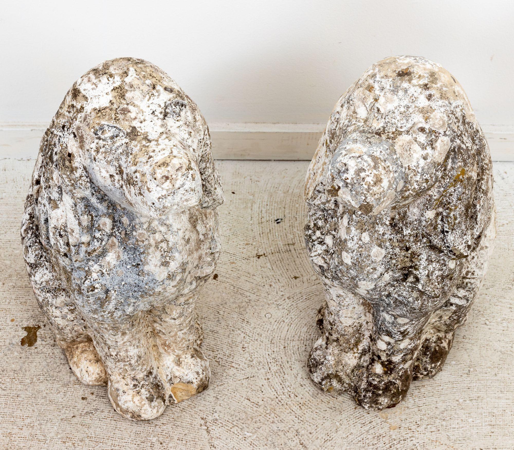 Circa mid-20th century pair of cast concrete cocker spaniel garden ornaments with original patina. Made in England. Please note of wear consistent with age.