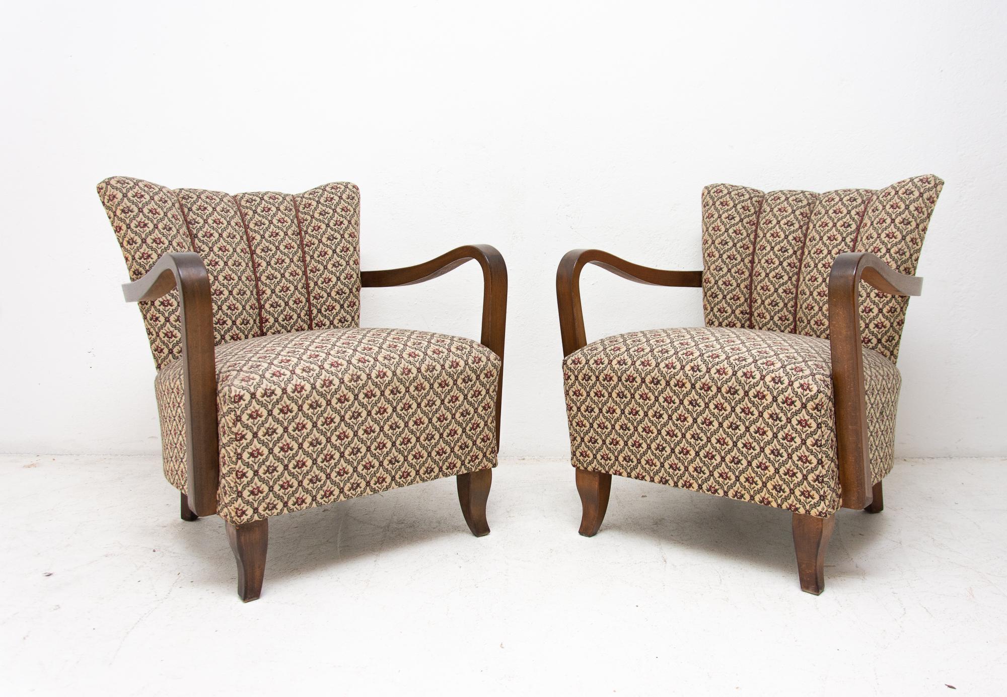 A pair of “cocktail” armchairs designed by Jindrich Halabala. Made in Czechoslovakia in the 1950s. Very interestingly shaped chairs. They features a beechwood structure and original upholstery. The chairs are in really very good vintage condition