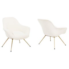 Pair of cocktail armchairs in golden brass. 1960’s.