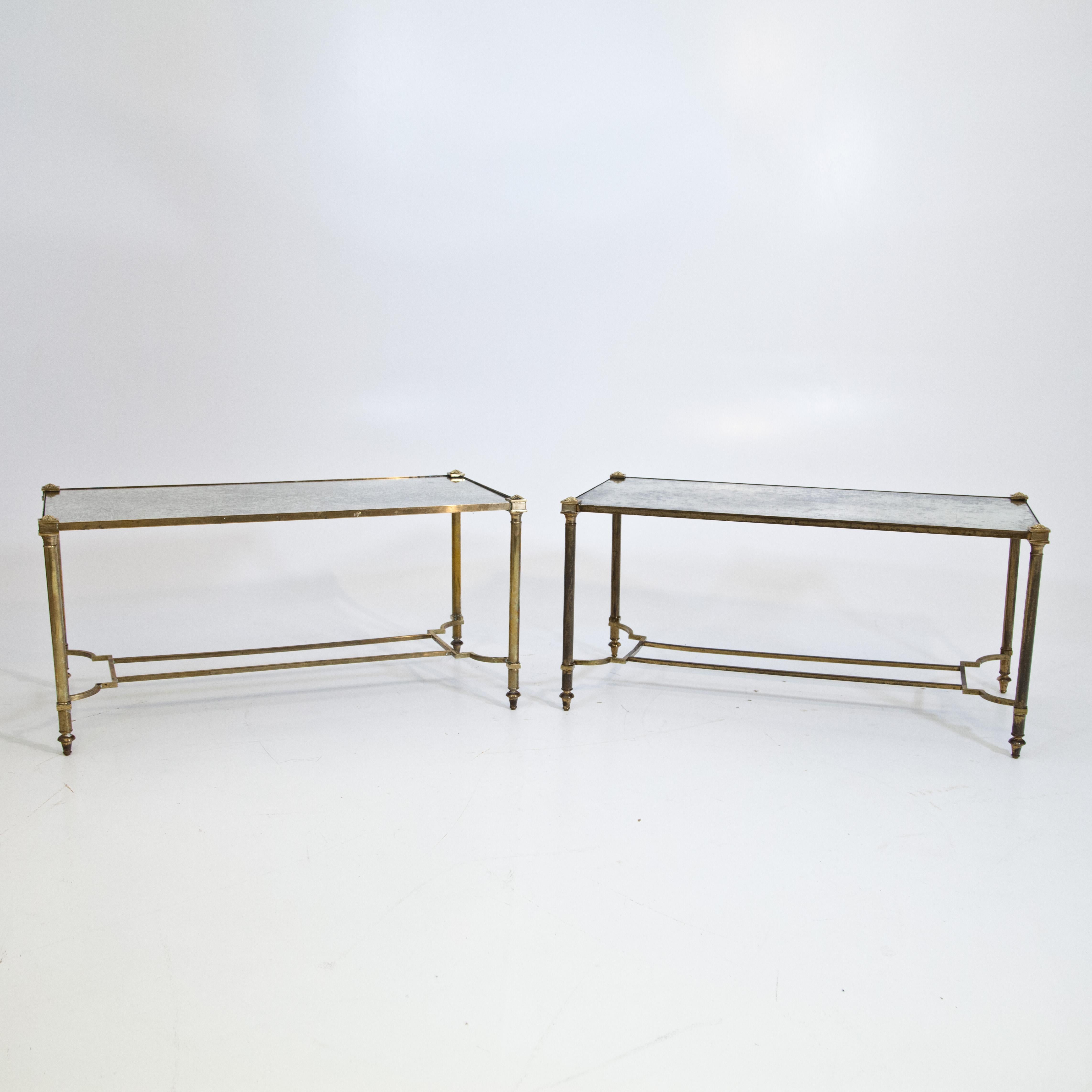 A pair of cocktail tables attributed to Maison Jansen. Patinated brass and mirror glass.