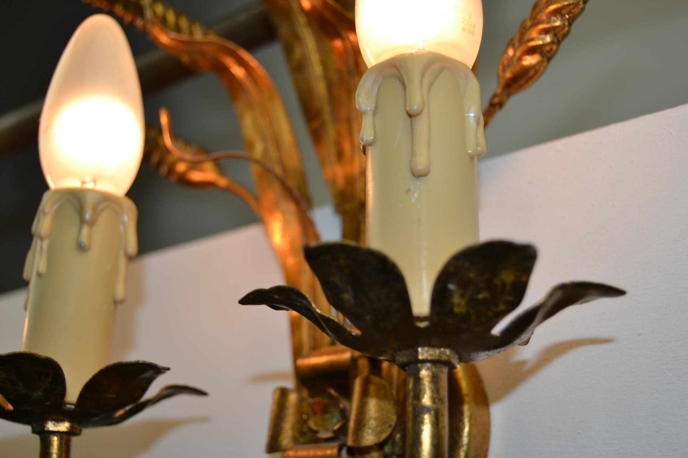 European Pair of Coco Chanel Style Florentine Wall Lights with gold finish, 1970s