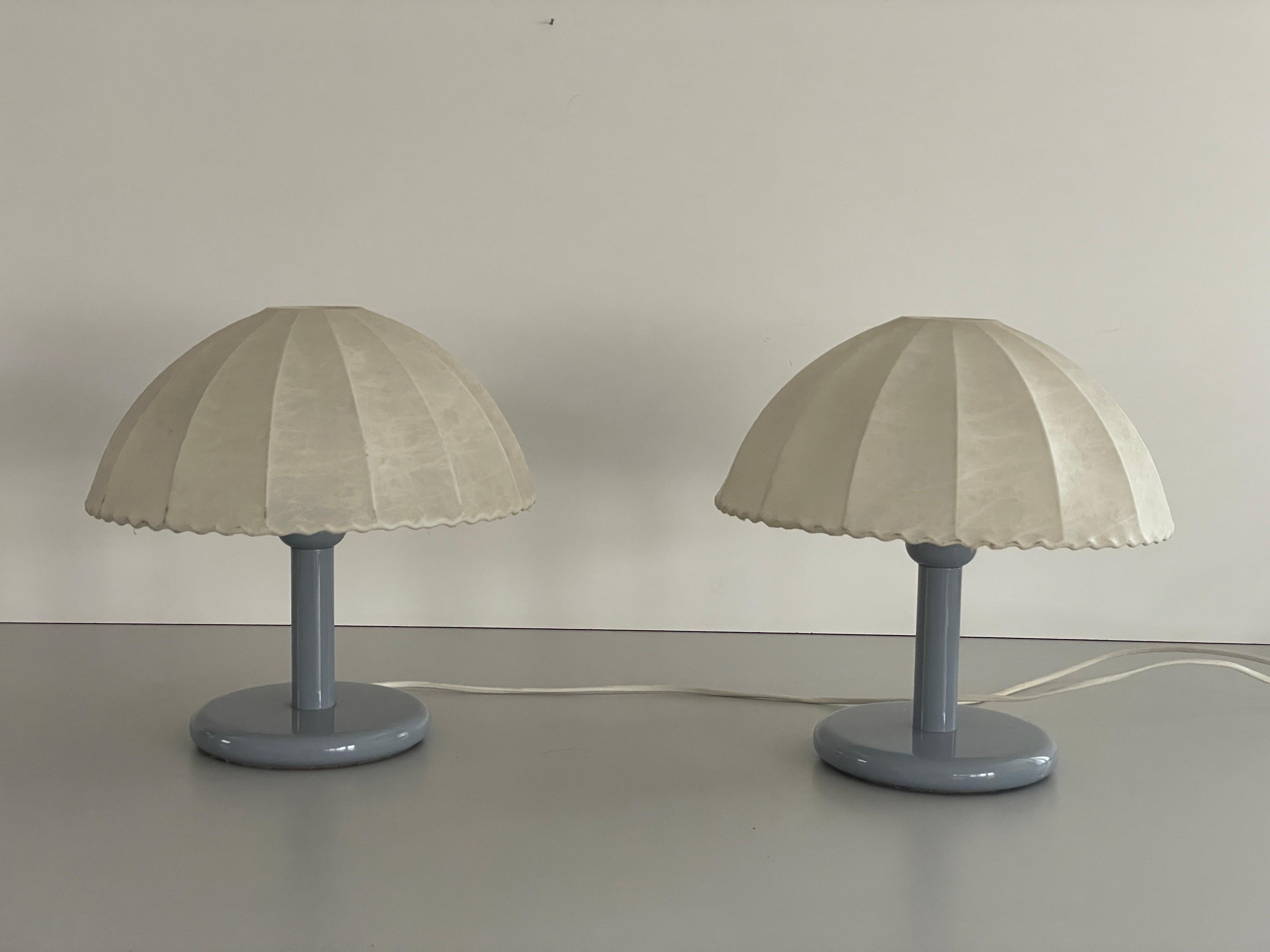 Pair of Cocoon Table Lamps with Grey Metal Base by GOLDKANT, 1960s, Germany
 
Cocoon shades & metal body

Minimal and natural design
Very high quality.
Fully functional.
Original cable and plug. These lamps are suitable for EU plug socket. Other
