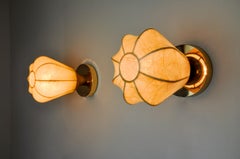 Pair of "Cocoon" wall lights, in resin and pine, Italy, 1970