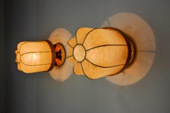 Pair of "cocoon" wall lights, polymer and pine, Italy, 1970