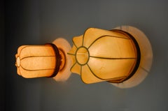 Pair of "cocoon" wall lights, resin and pine, Italy, 1970