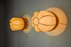 Pair of "cocoon" wall lights, resin and pine, Italy, 1970