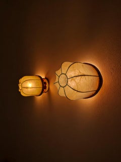 Pair of "cocoon" wall lights, resin and pine, Italy, 1970