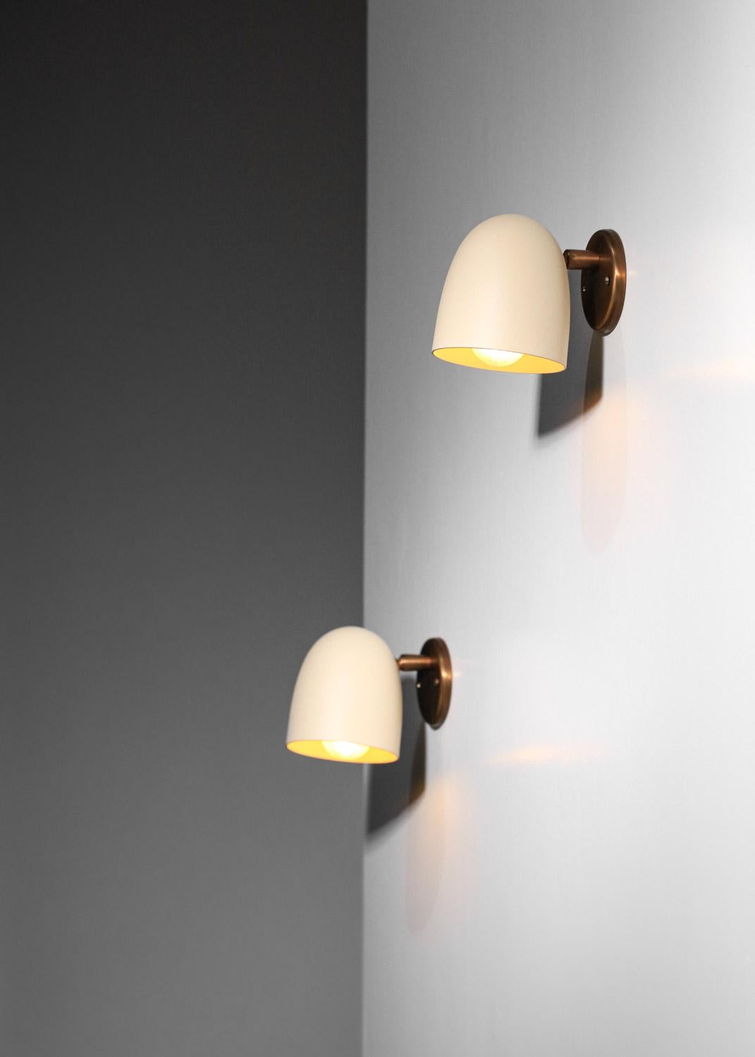 Lacquered pair of Danke Studio sconces brass and lacquered metal 
