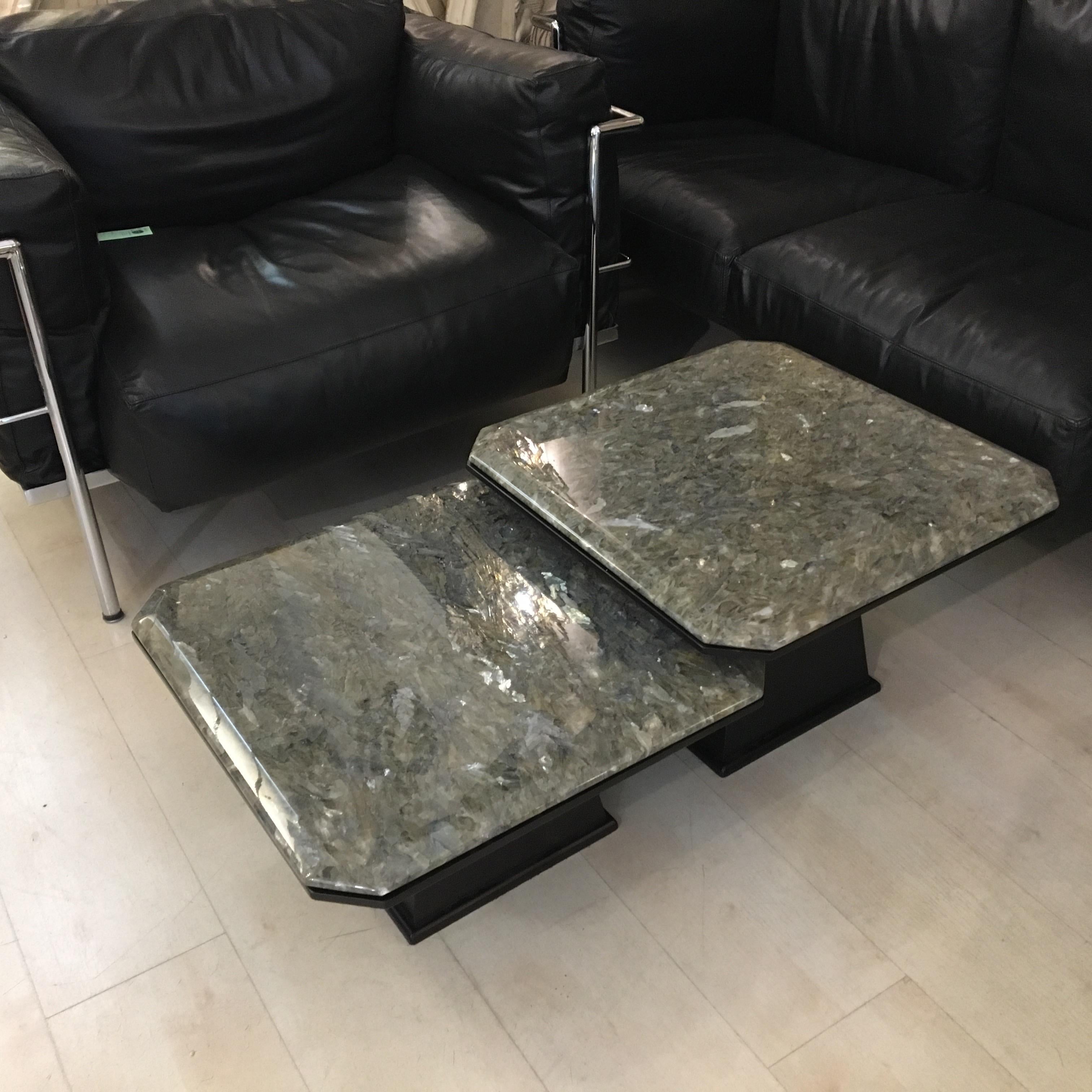 Pair of interlocking coffee tables with different heights, resin top with silver leaves effect. Base made of black lacquered wood.
1980’s
Measures: cm 55 x 55 x 28
cm 55x 55 x 35.