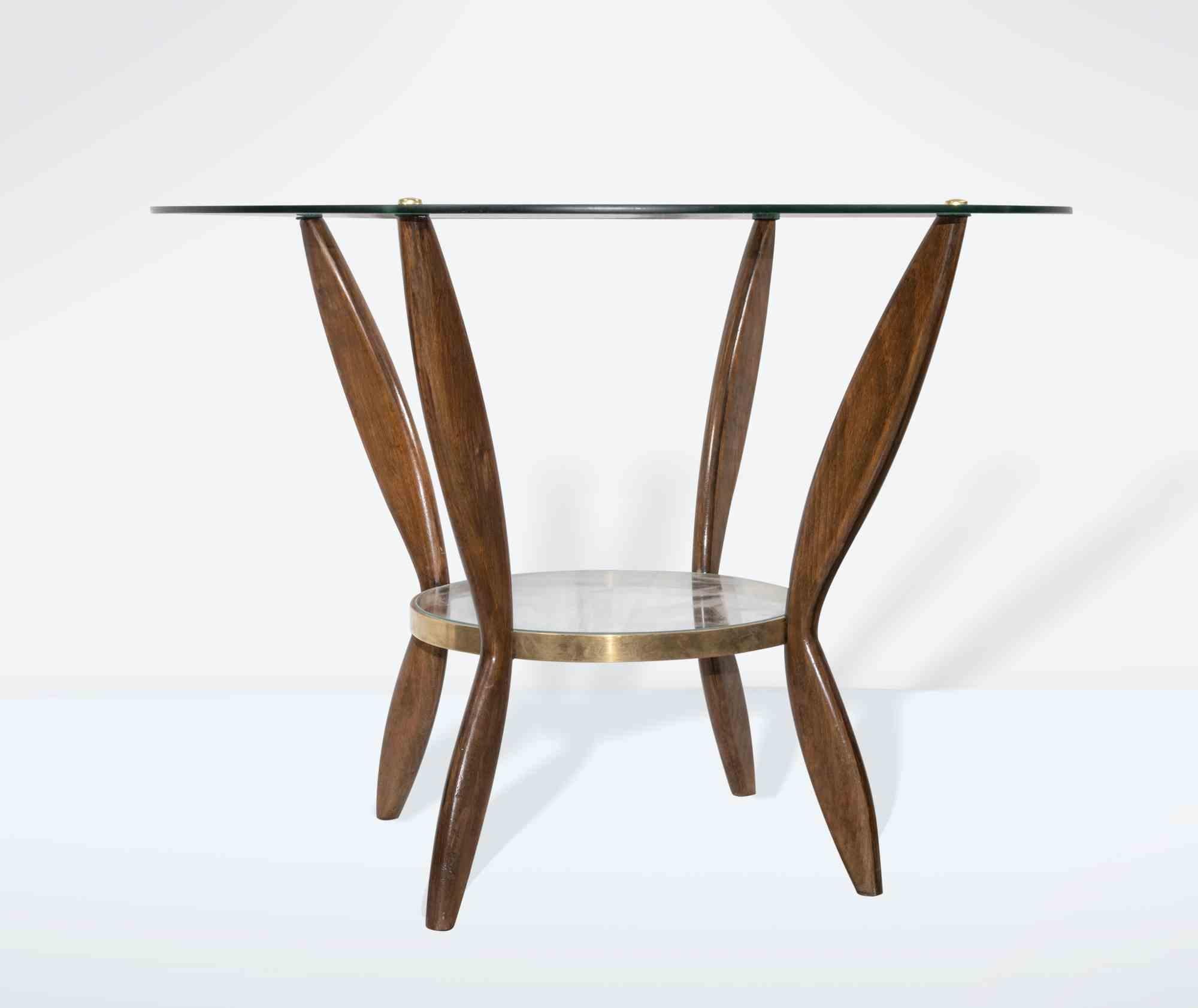 Das Couchtisch-Paar ist ein originelles Design-Möbelstück von Gio Ponti aus den 1950er Jahren.

Schönes Paar Couchtische aus Holz mit Glasplatten und Messingoberflächen. Buchenholz.

Gio Ponti (Mailand 1891 - 1979) ist ein Architekt, Designer