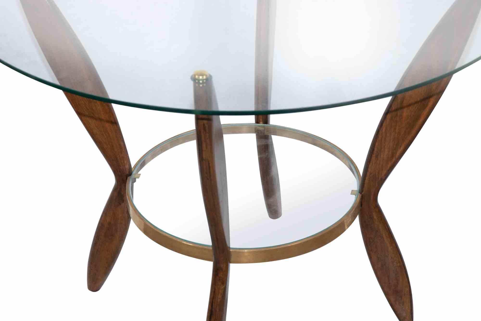 Pair of Coffee Table is an original design furniture item attributed to Gio Ponti, and realized in the 1950s.

Beautiful pair of wooden coffee tables with glass tops and brass finishes. Beech Wood.

Gio Ponti (Milan 1891 - 1979) is an architect,