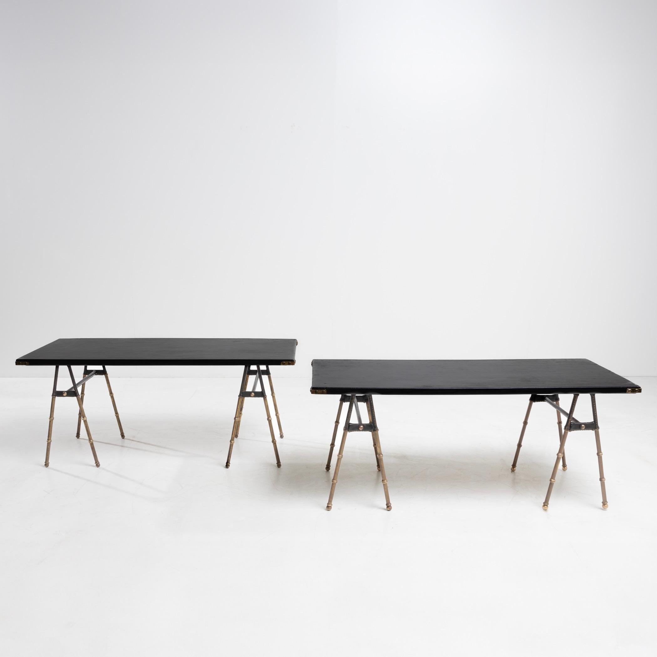 Mid-Century Modern Pair of coffee tables with trestle legs by Jacques Adnet For Sale