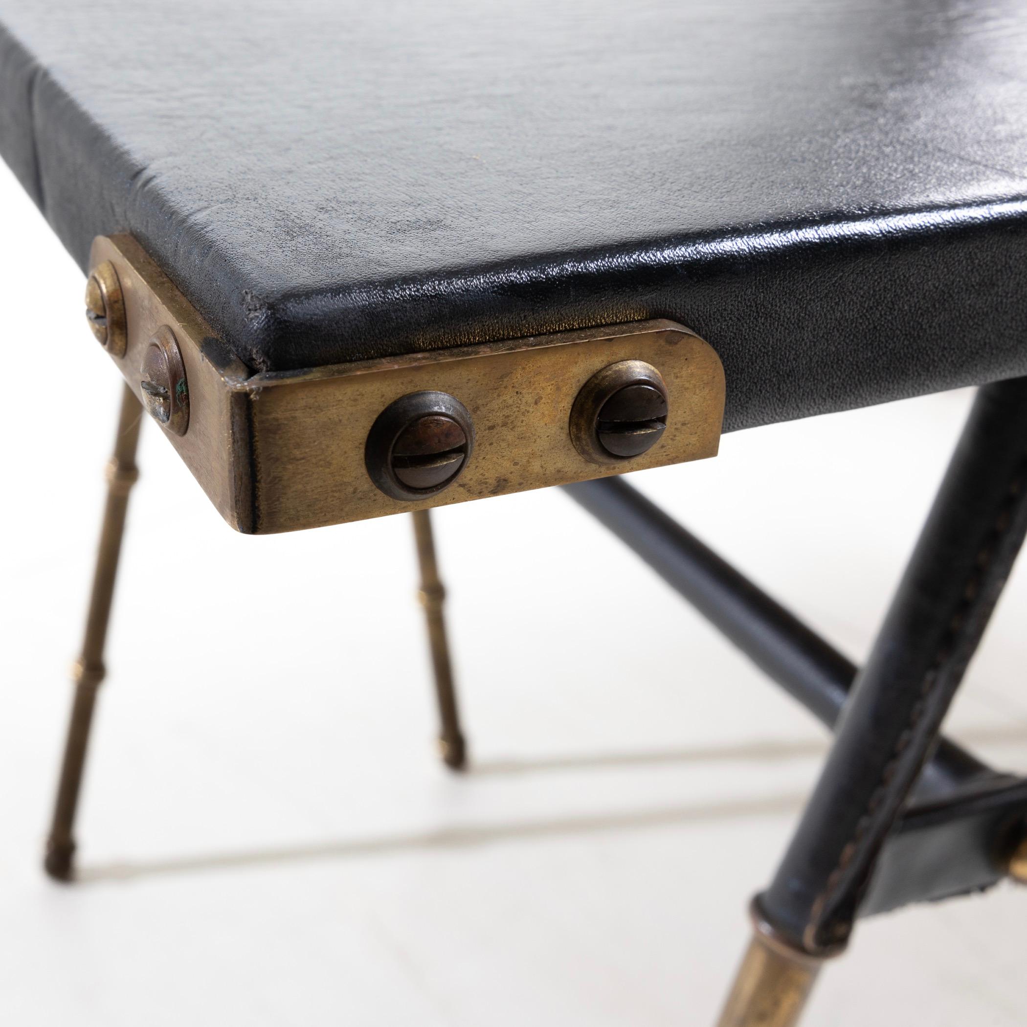 Bronze Pair of coffee tables with trestle legs by Jacques Adnet For Sale