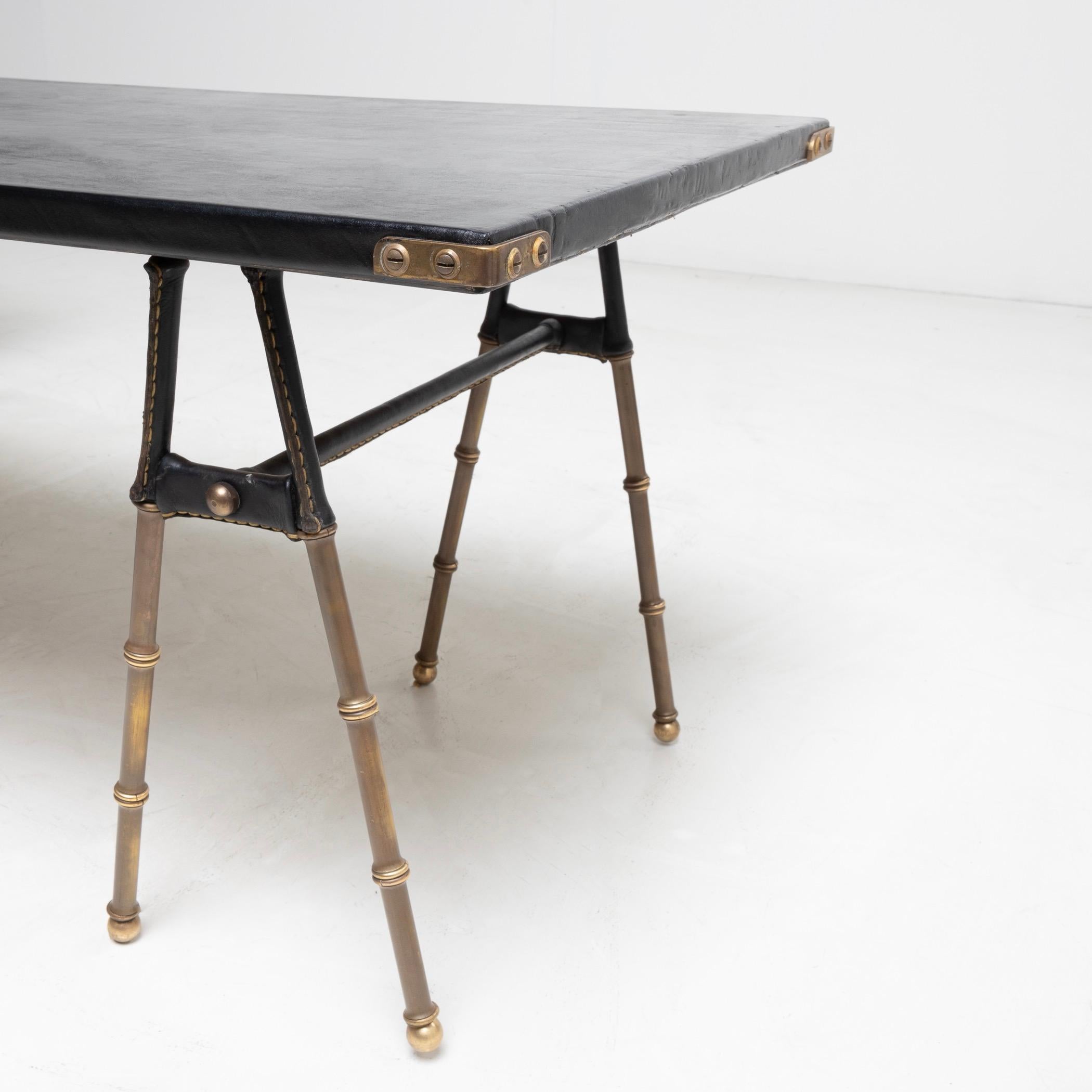 Pair of coffee tables with trestle legs by Jacques Adnet For Sale 1