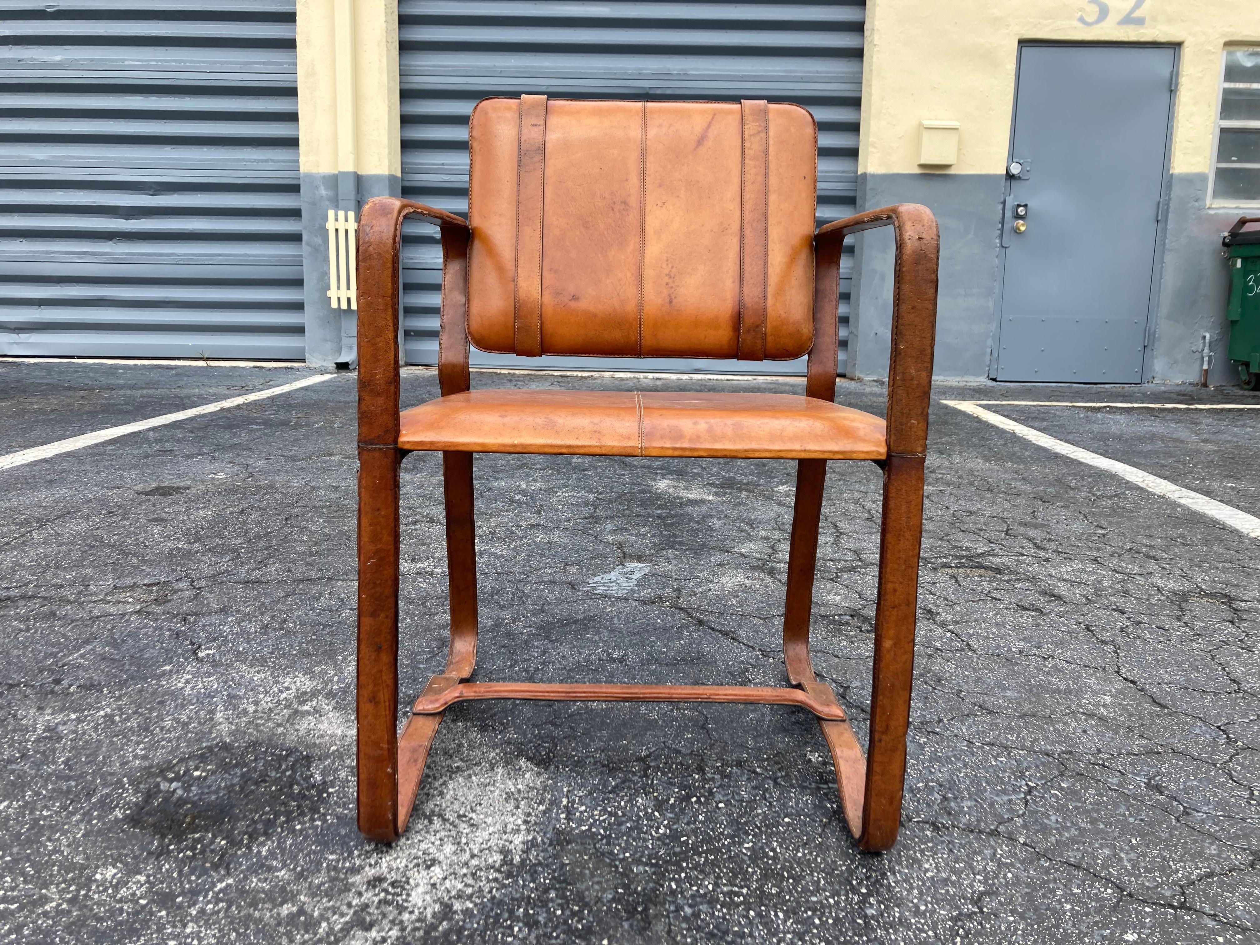 Pair of Cognac Leather Wrapped Arm Chairs in the style of Jacques Adnet 7