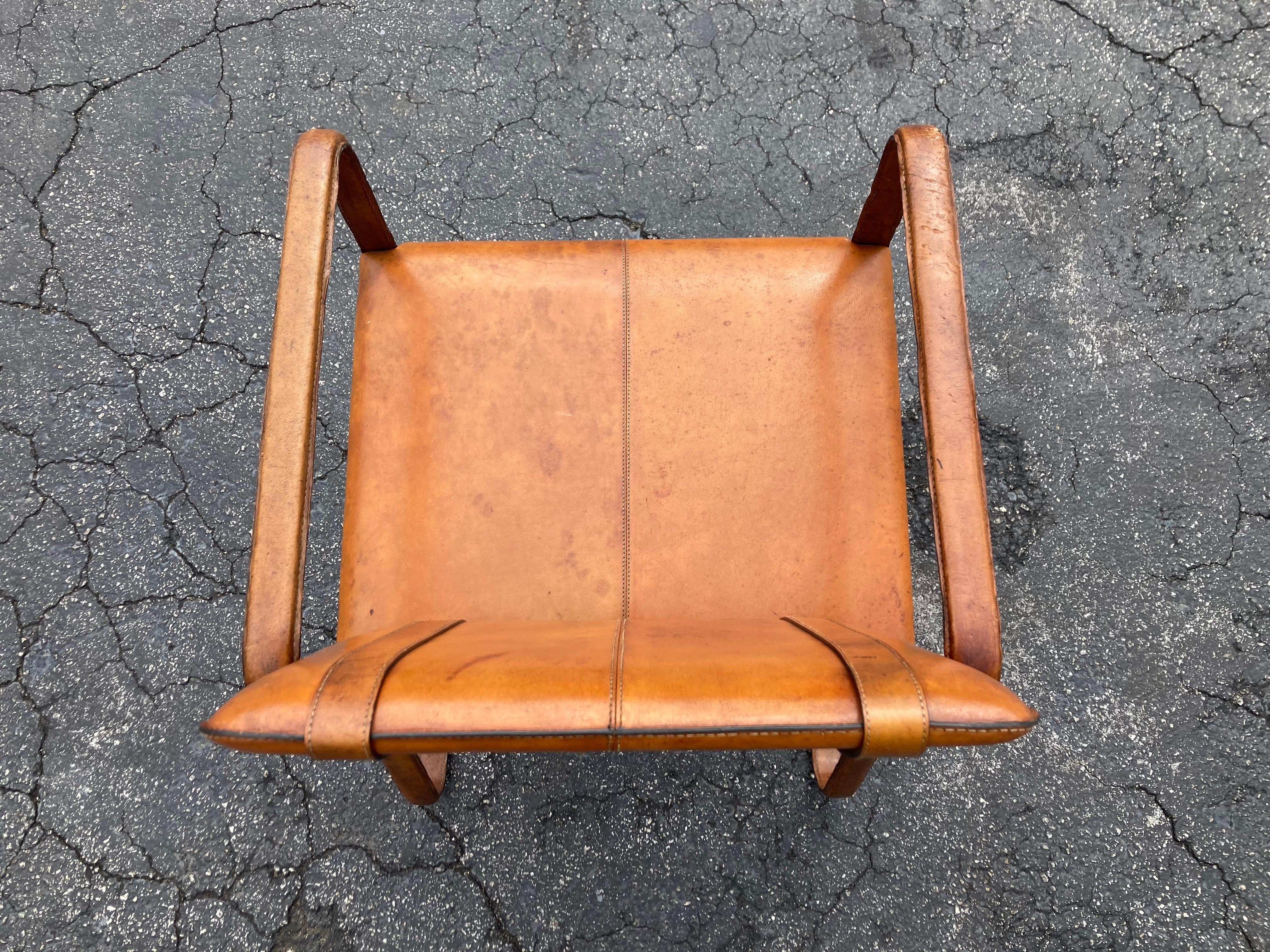 Pair of Cognac Leather Wrapped Arm Chairs in the style of Jacques Adnet 9