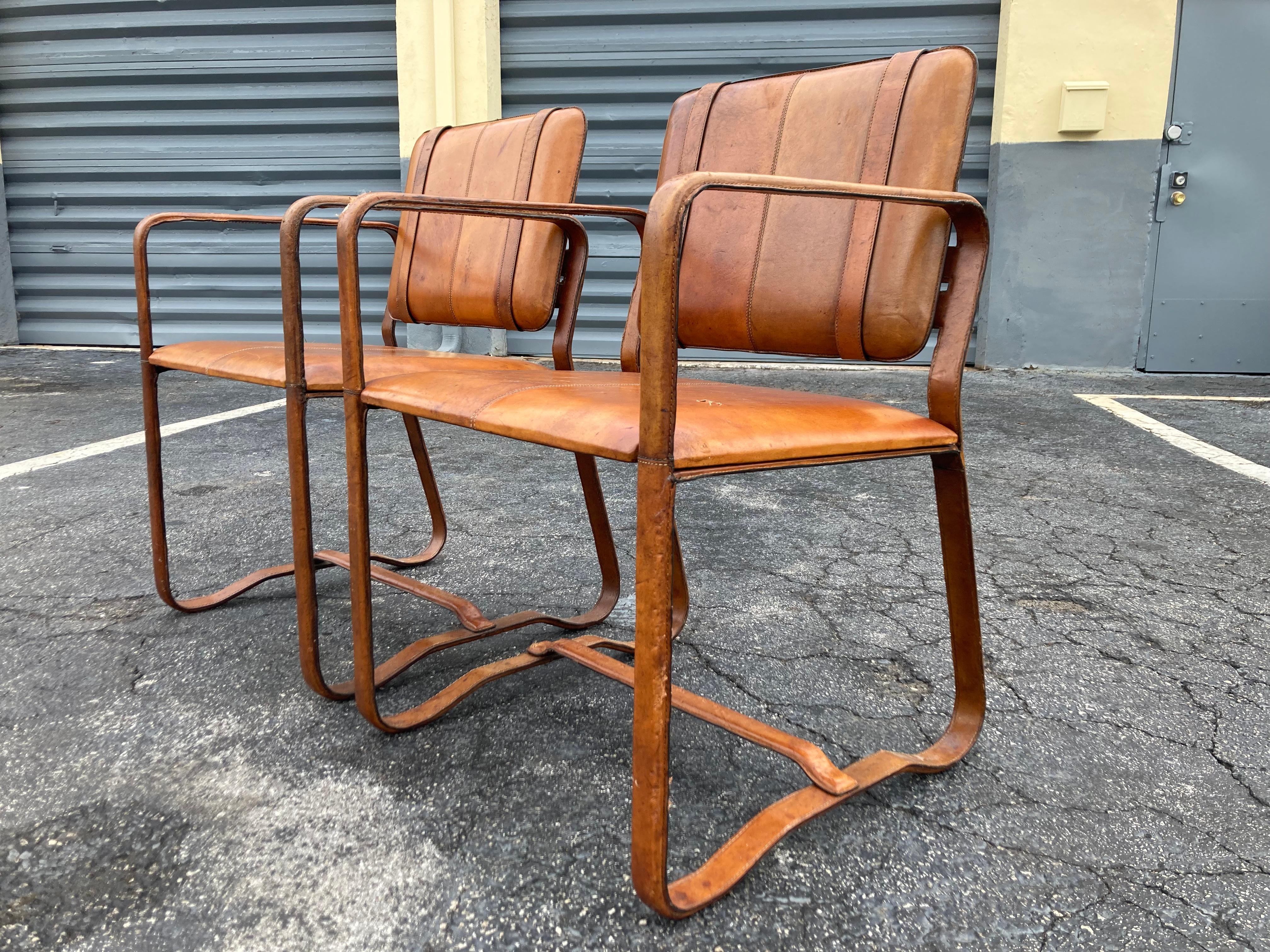 Modern Pair of Cognac Leather Wrapped Arm Chairs in the style of Jacques Adnet