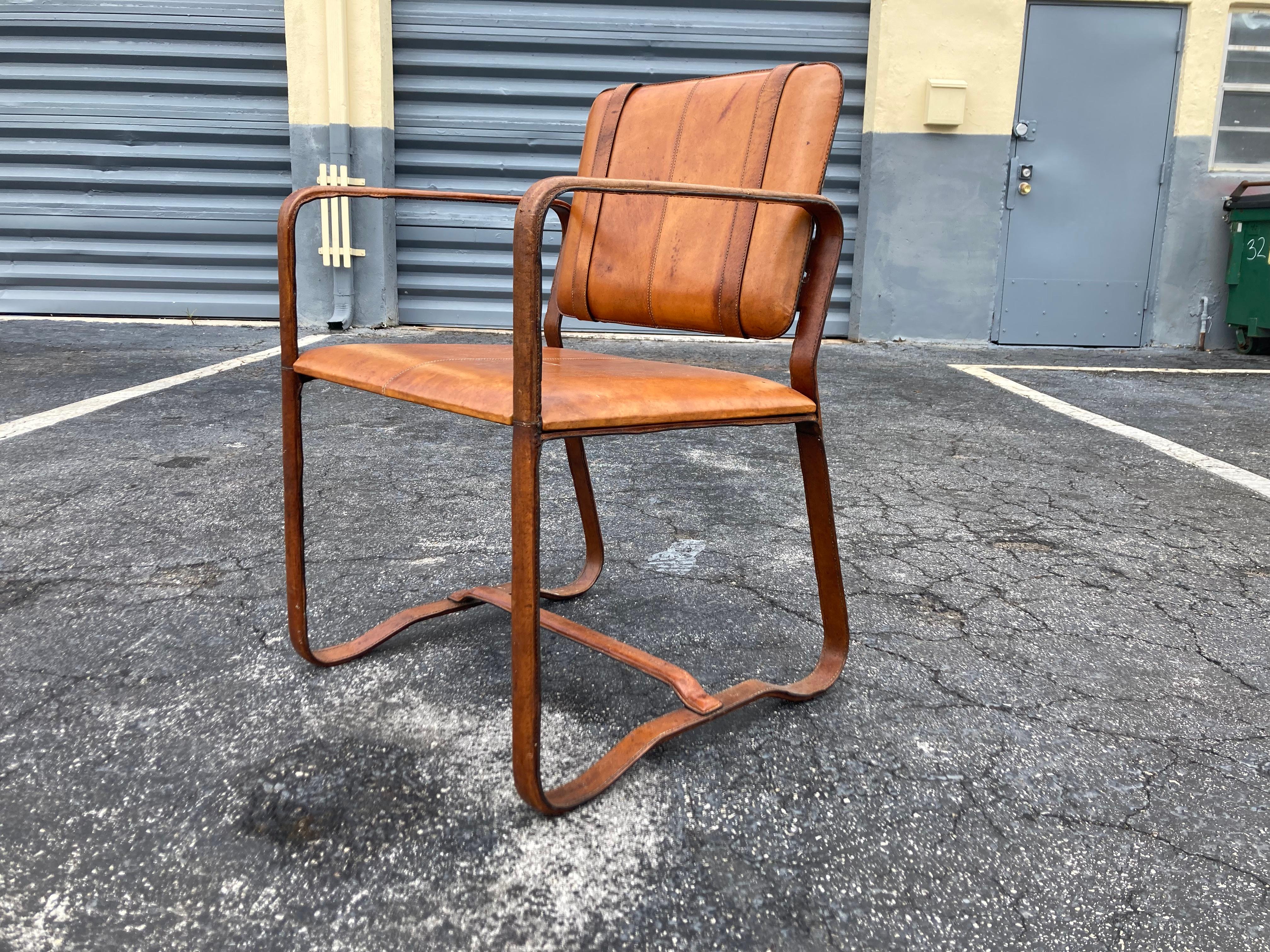 Pair of Cognac Leather Wrapped Arm Chairs in the style of Jacques Adnet 2
