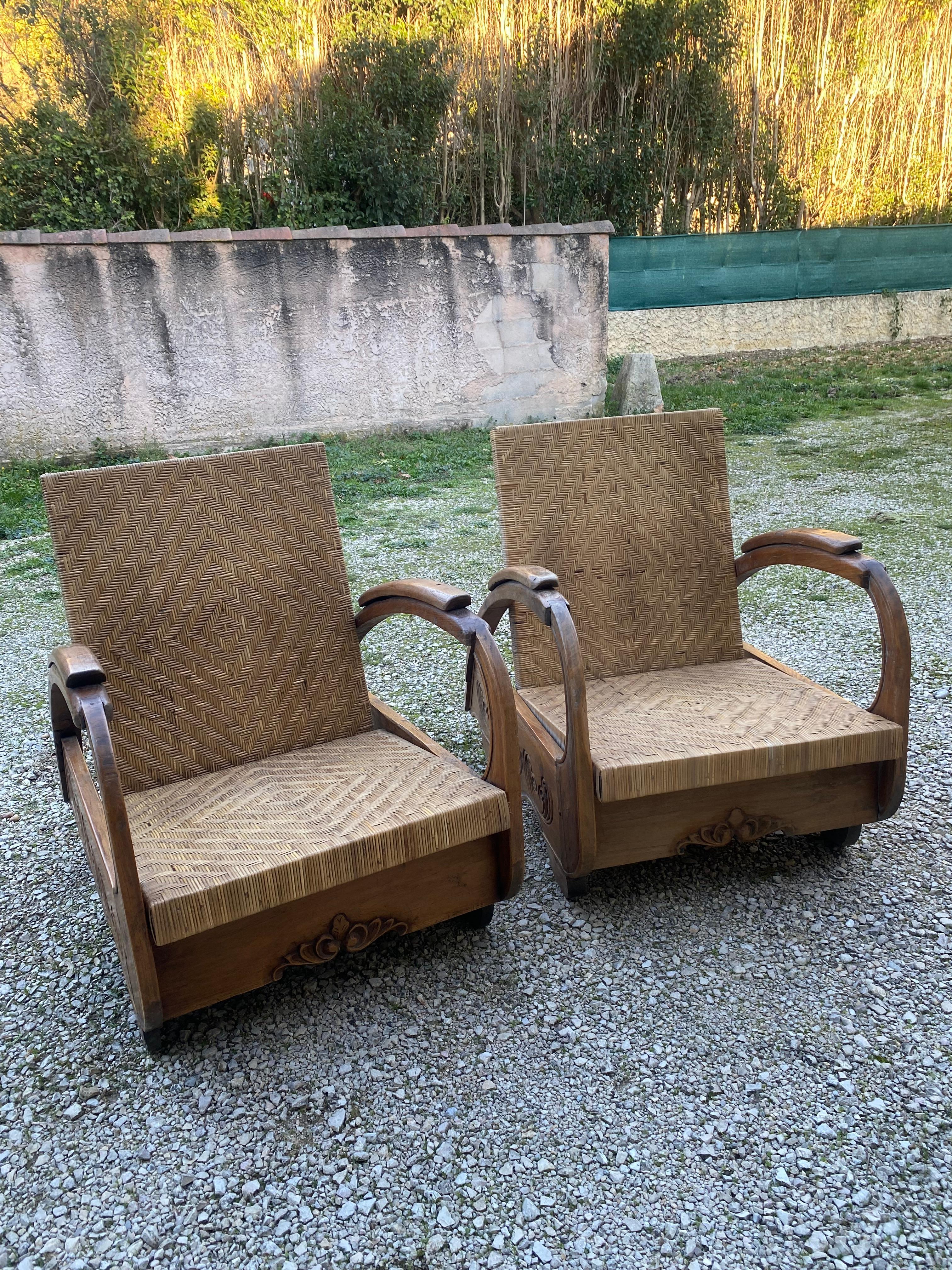 Paire de fauteuils art déco coloniaux Rotin et âme en teck Très bon état 
Circa 1940 
D 92 x L 61 x H 55 cm
1 600 par paire