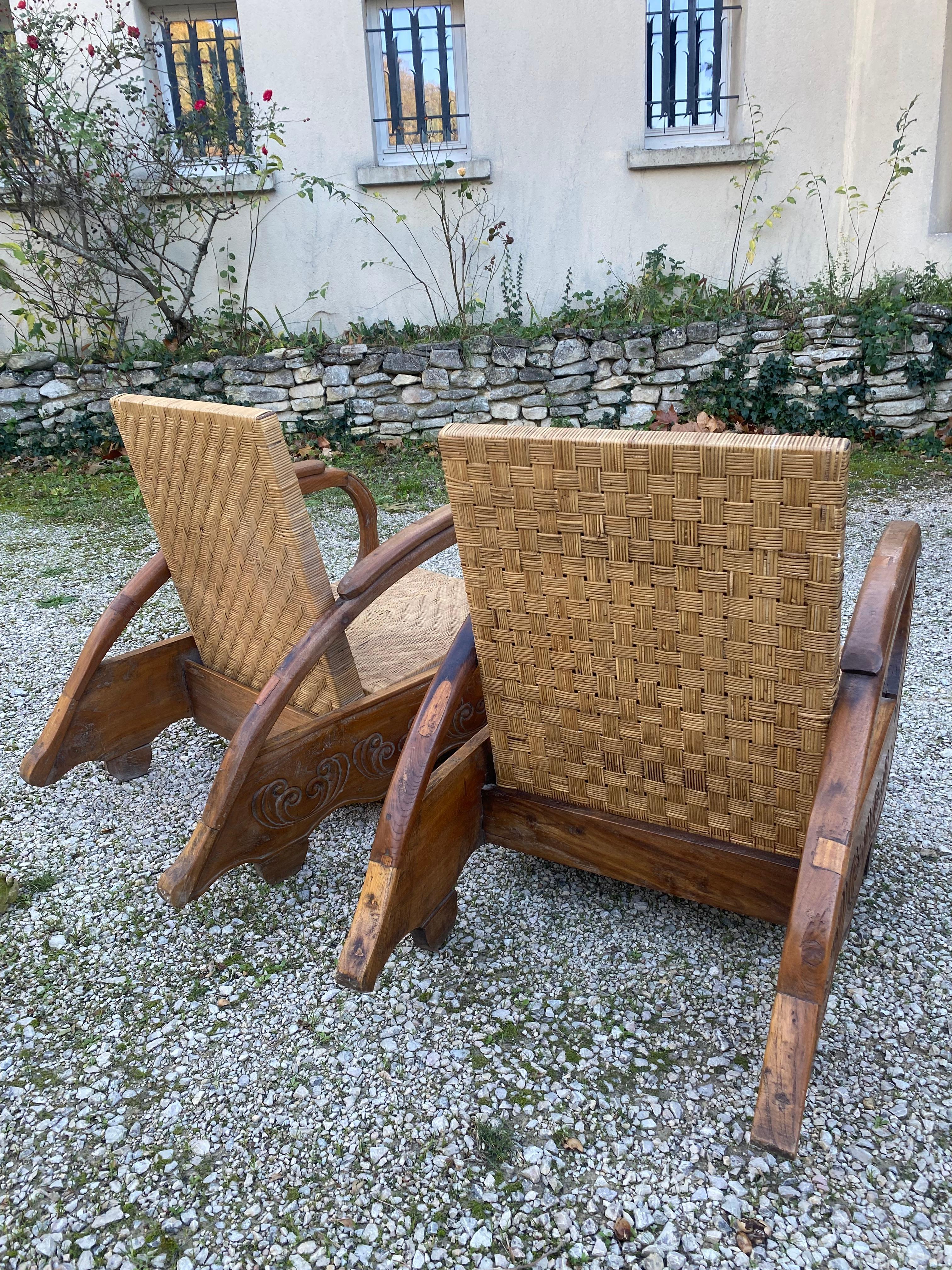 Bois Pair of colonial art deco armchairs Rattan and teak core en vente
