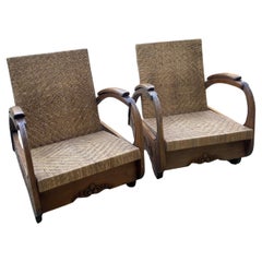 Pair of colonial art deco armchairs Rattan and teak core