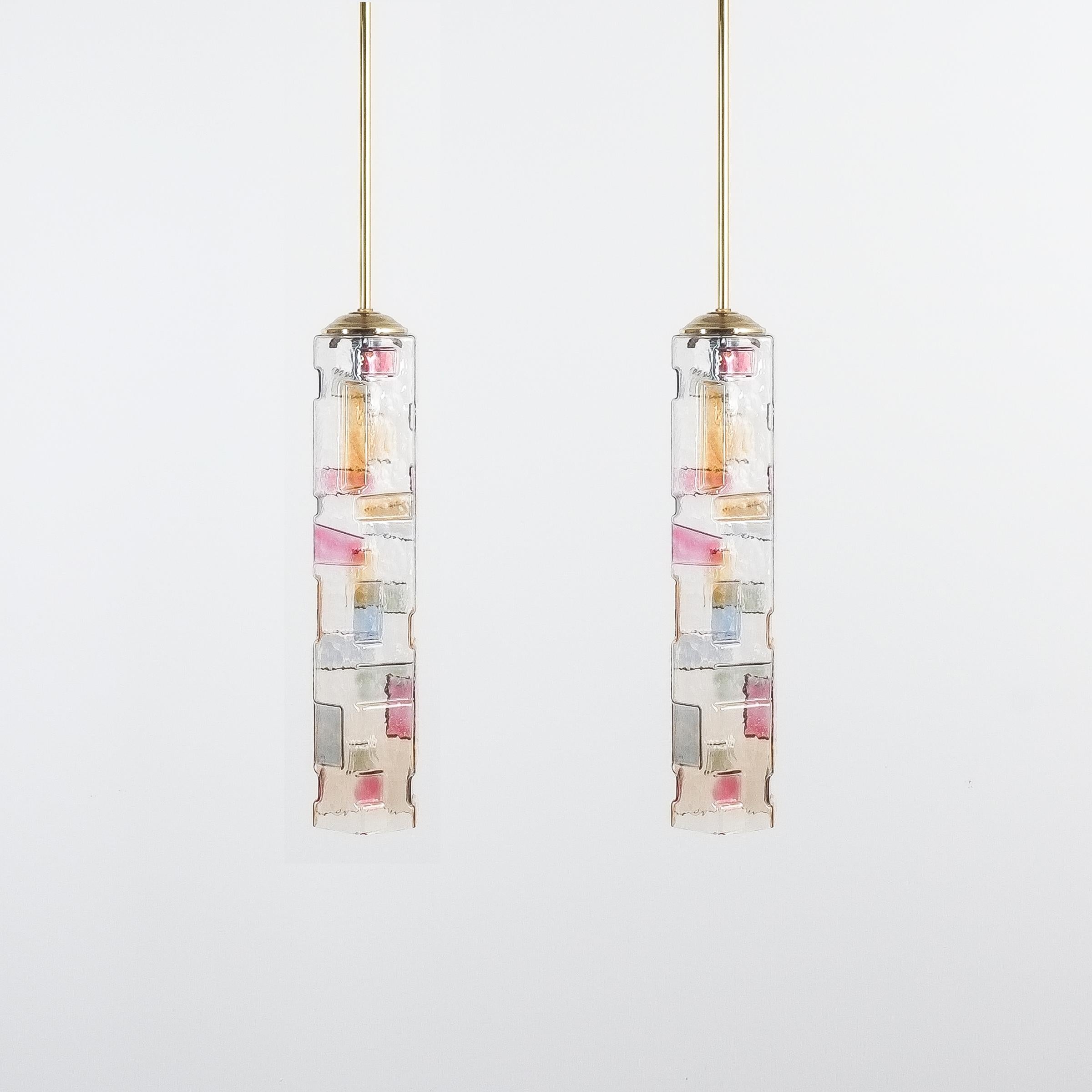 Pair of colored glass pendant lamps style Poliarte, Italy, circa 1955. Nice pair of slender glass hexagonal tubes with some three-dimensional and colored patterns. The condition is very good, refurbished an newly rewired. Dimensions of the light