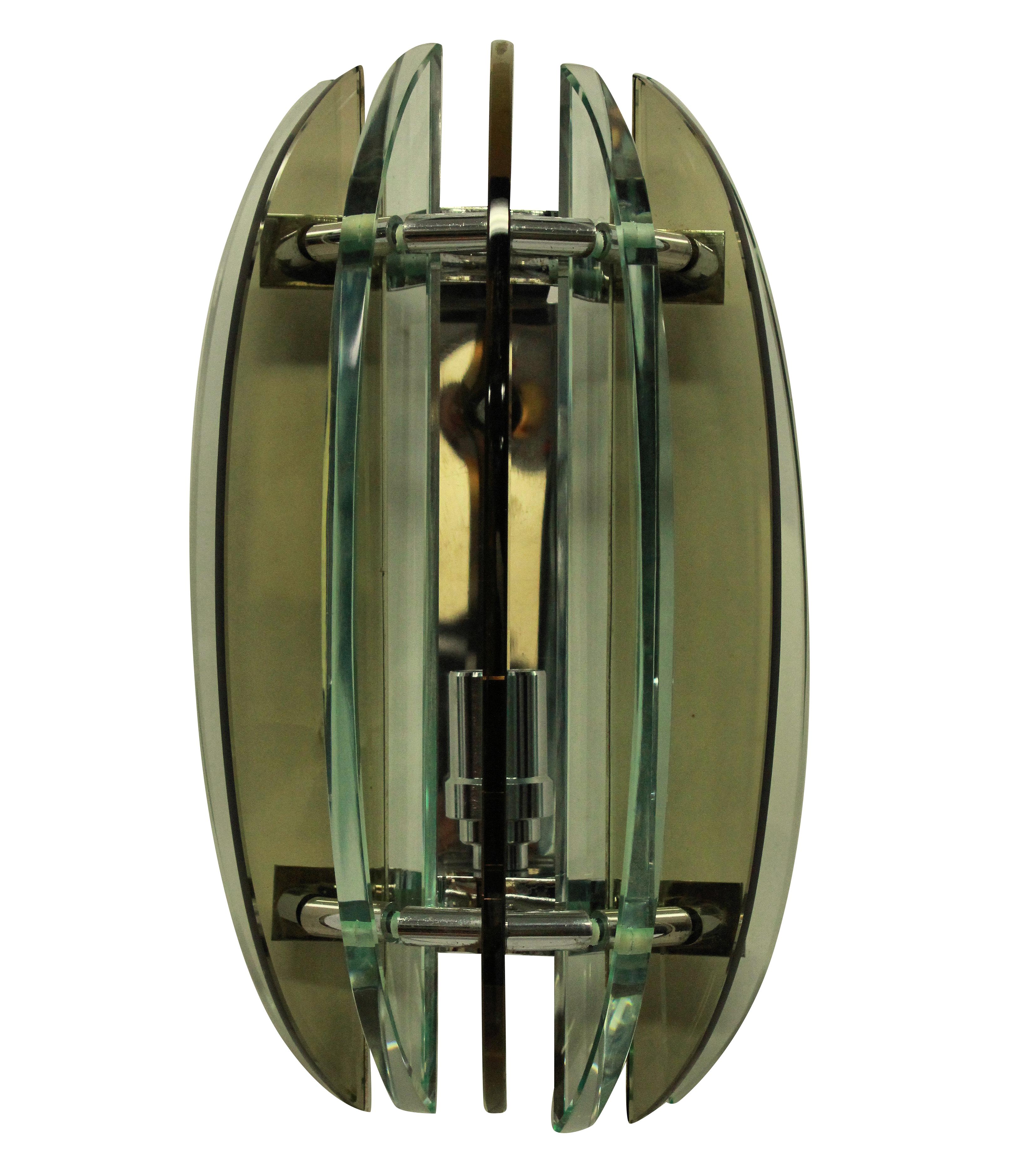 A pair of Italian midcentury colored glass wall lights by Veca. In pale brown and greens, with only a small chip to the base of one glass finial.